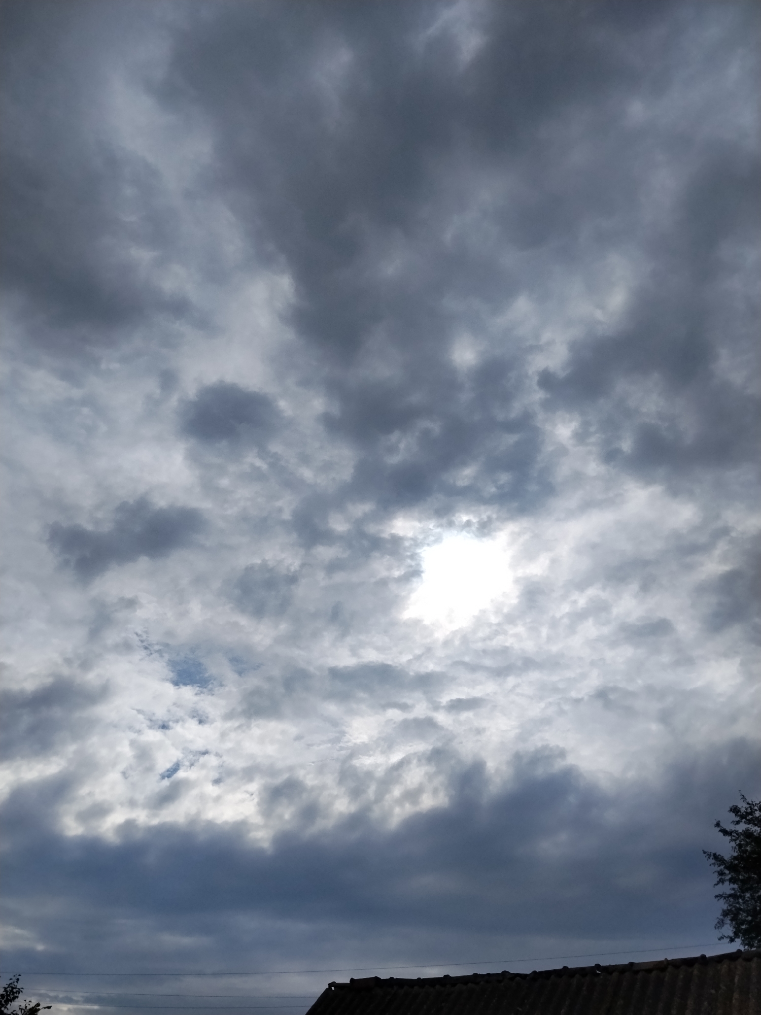 Heavy cloud cover rolls over Ustyvytsia on a stormy afternoon