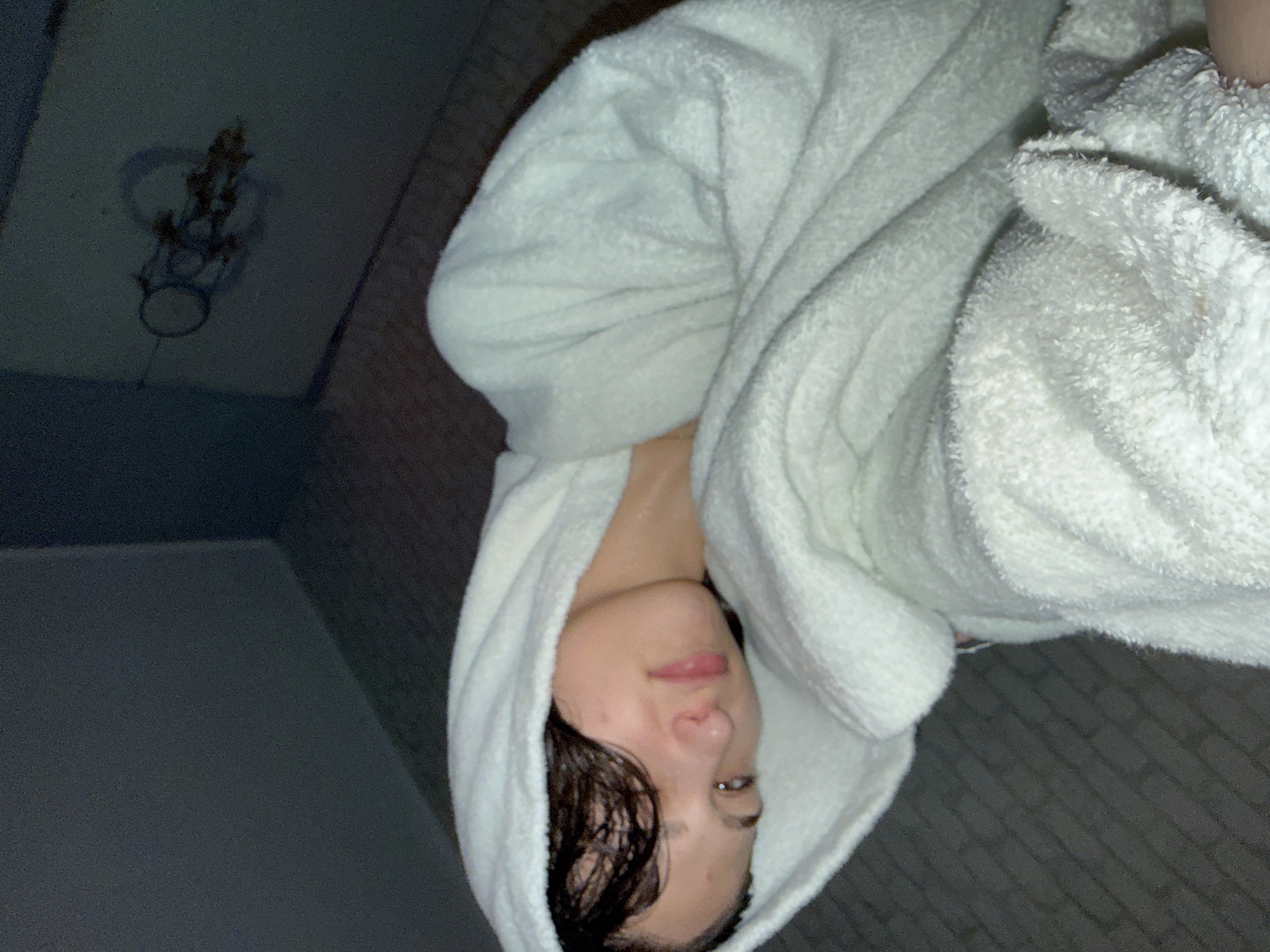 Woman in towel observed indoors in Sofia
