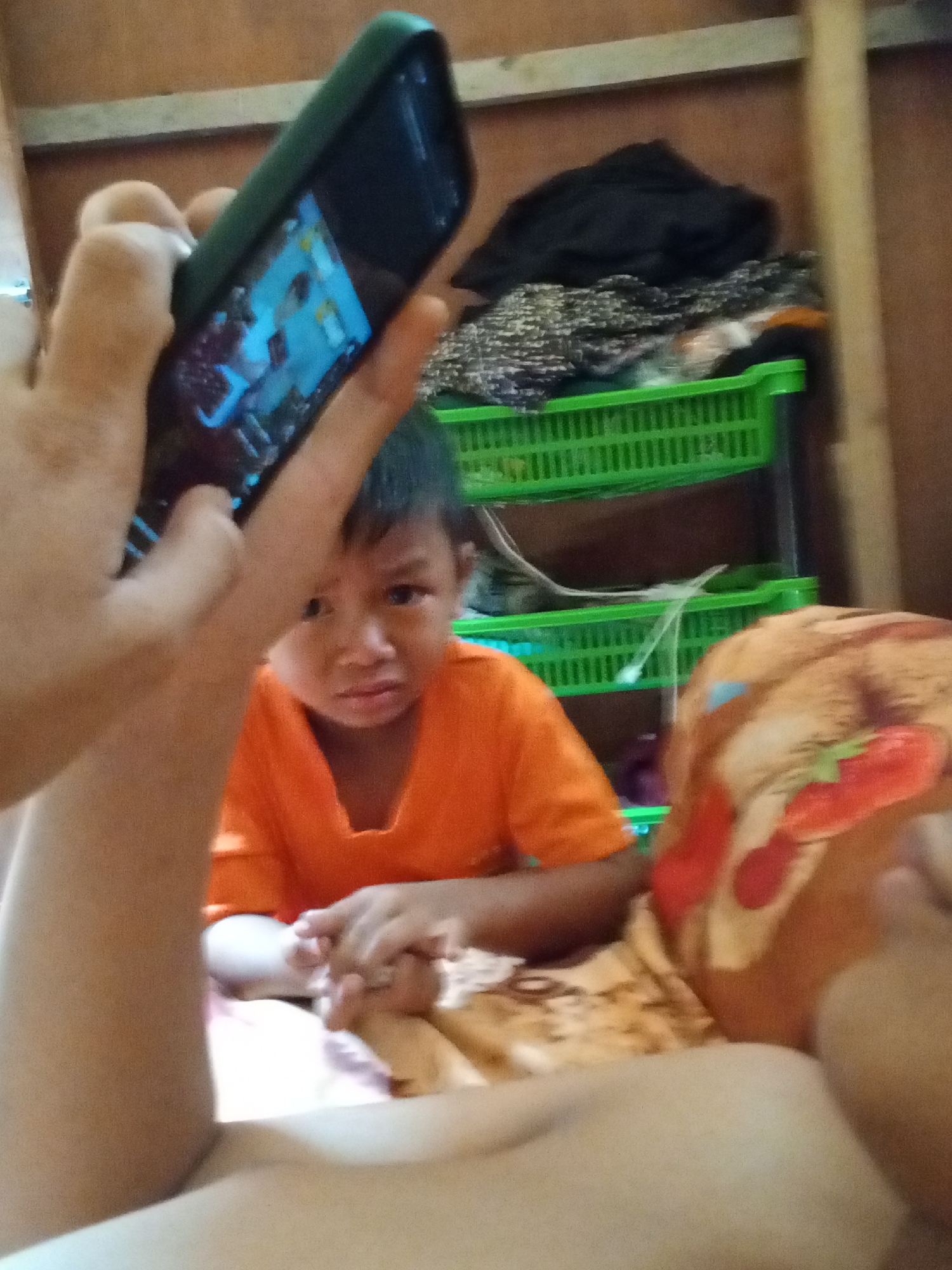 Lazy morning at home in rural Indonesia, phones and downtime
