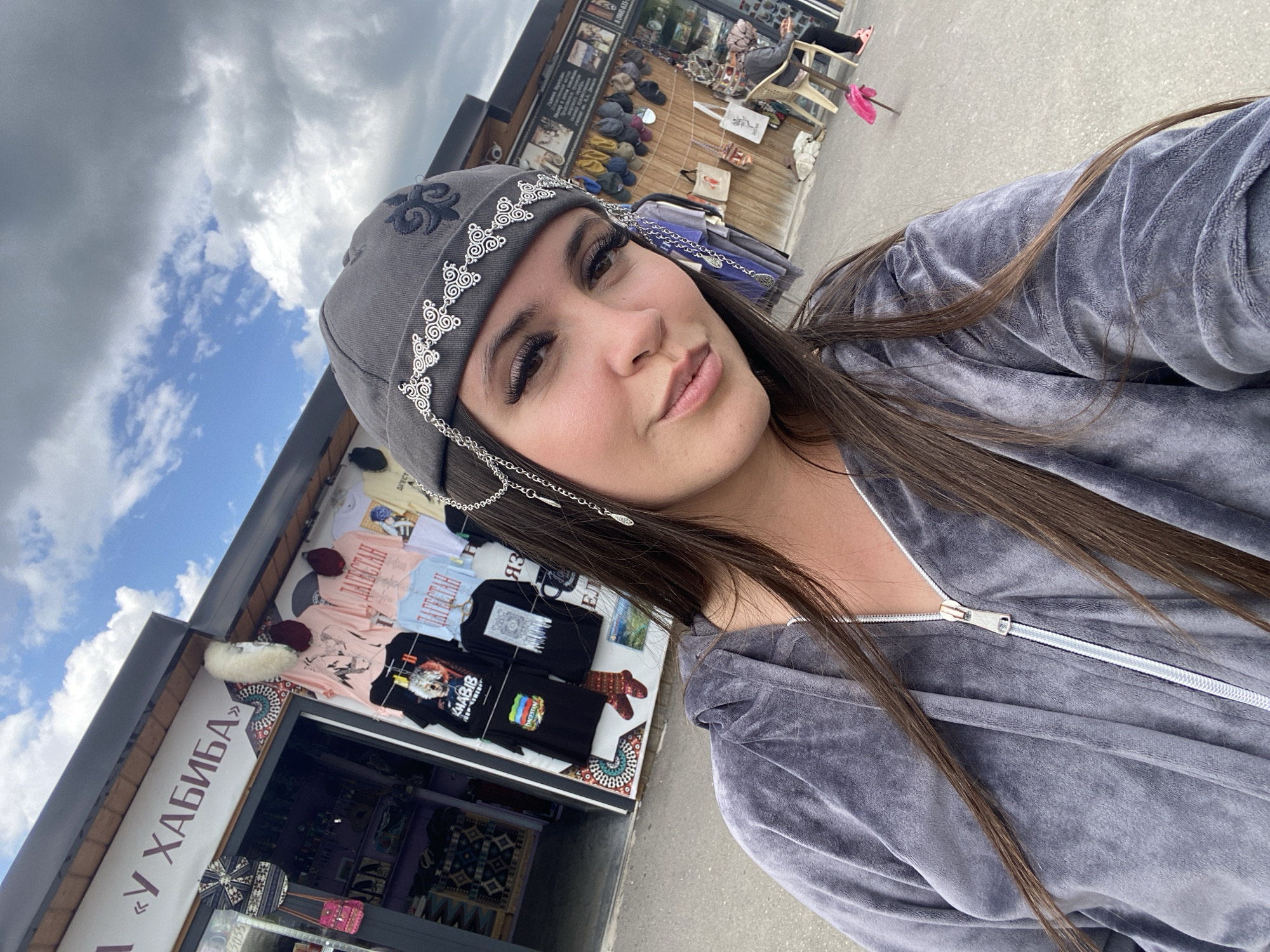 Selfies at an outdoor market in Tsalkita, Russia