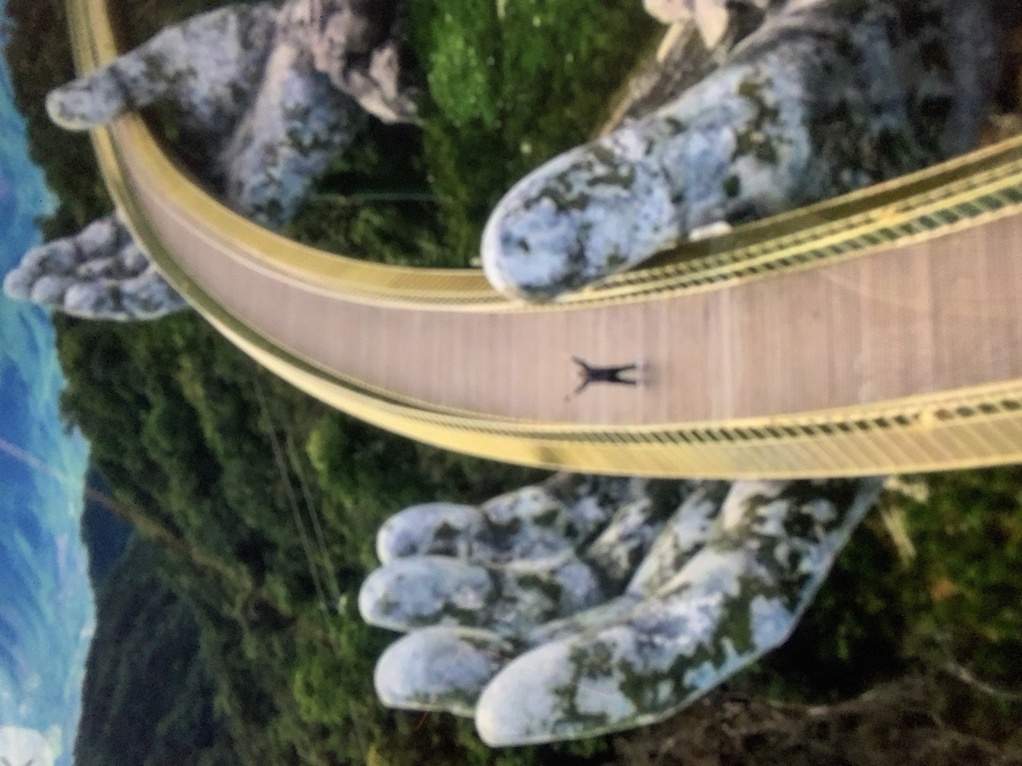 Tourists pose and relax at Vietnam's Golden Bridge attraction