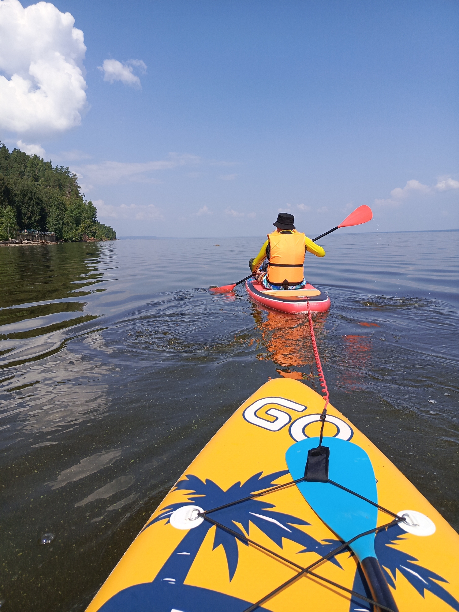 Lazy summer paddleboard session on a Russian river
