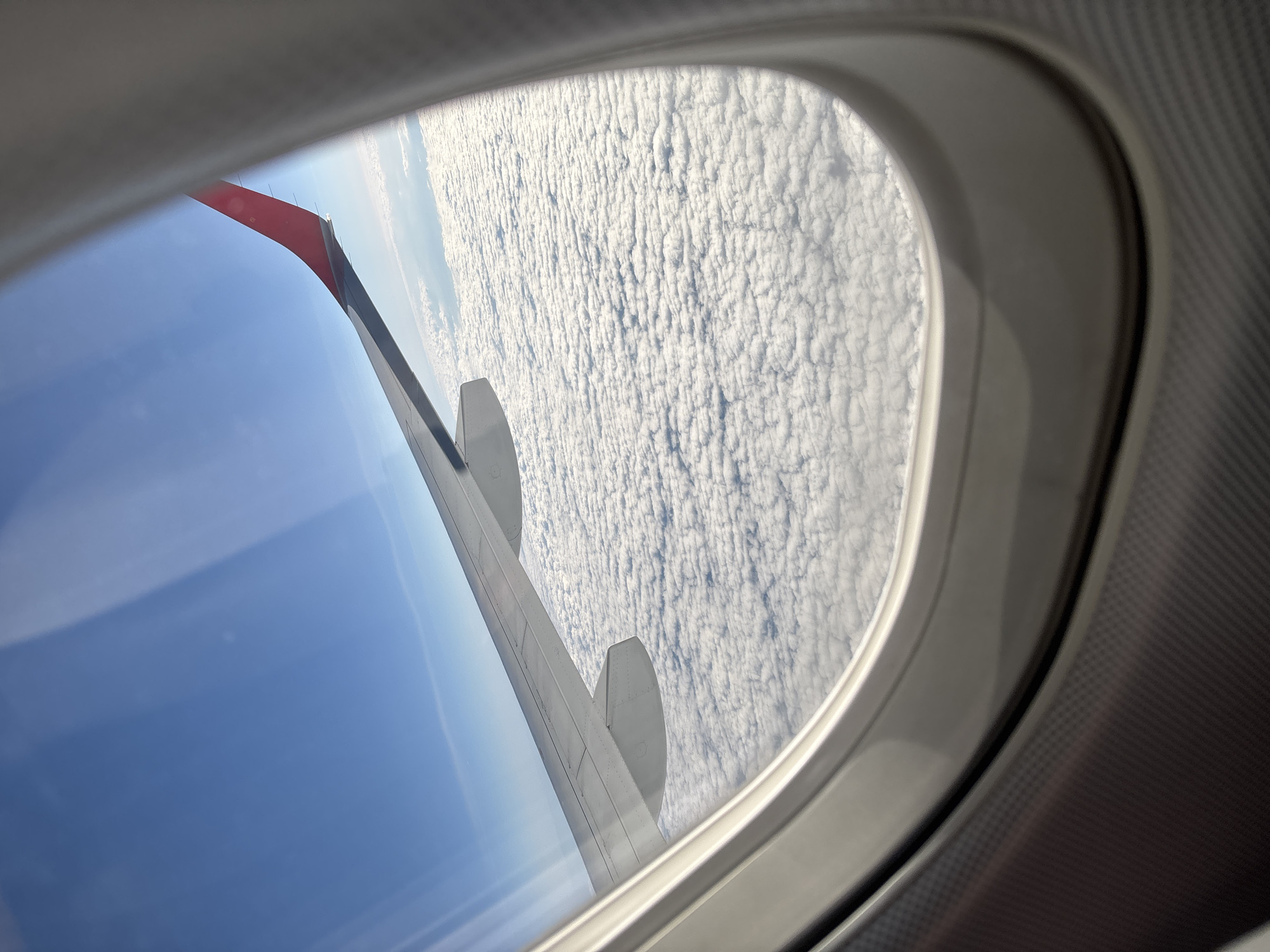 Passenger documents aerial views during morning flight over Austria
