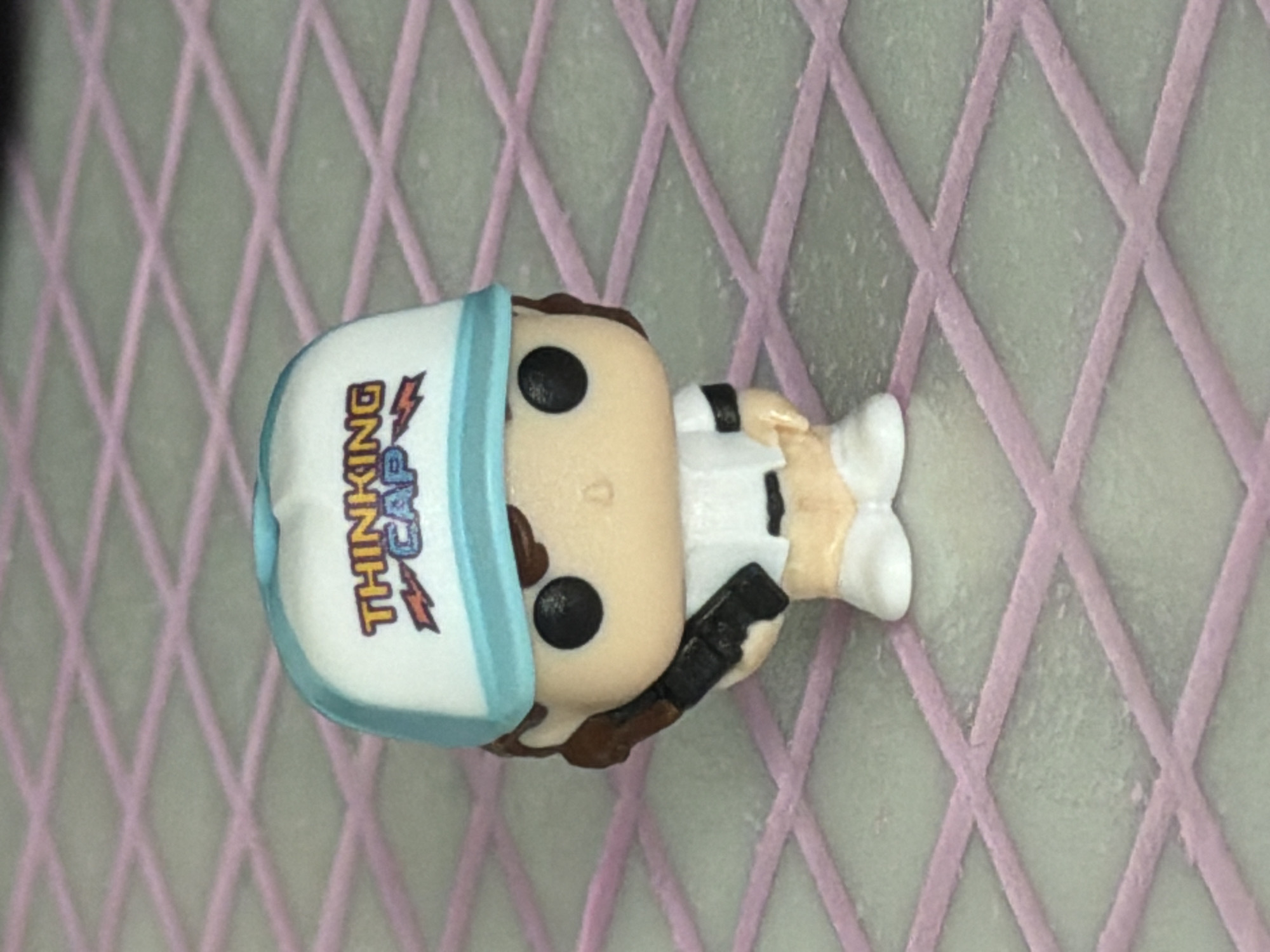 Funko Pop figurines and quirky desk items up close