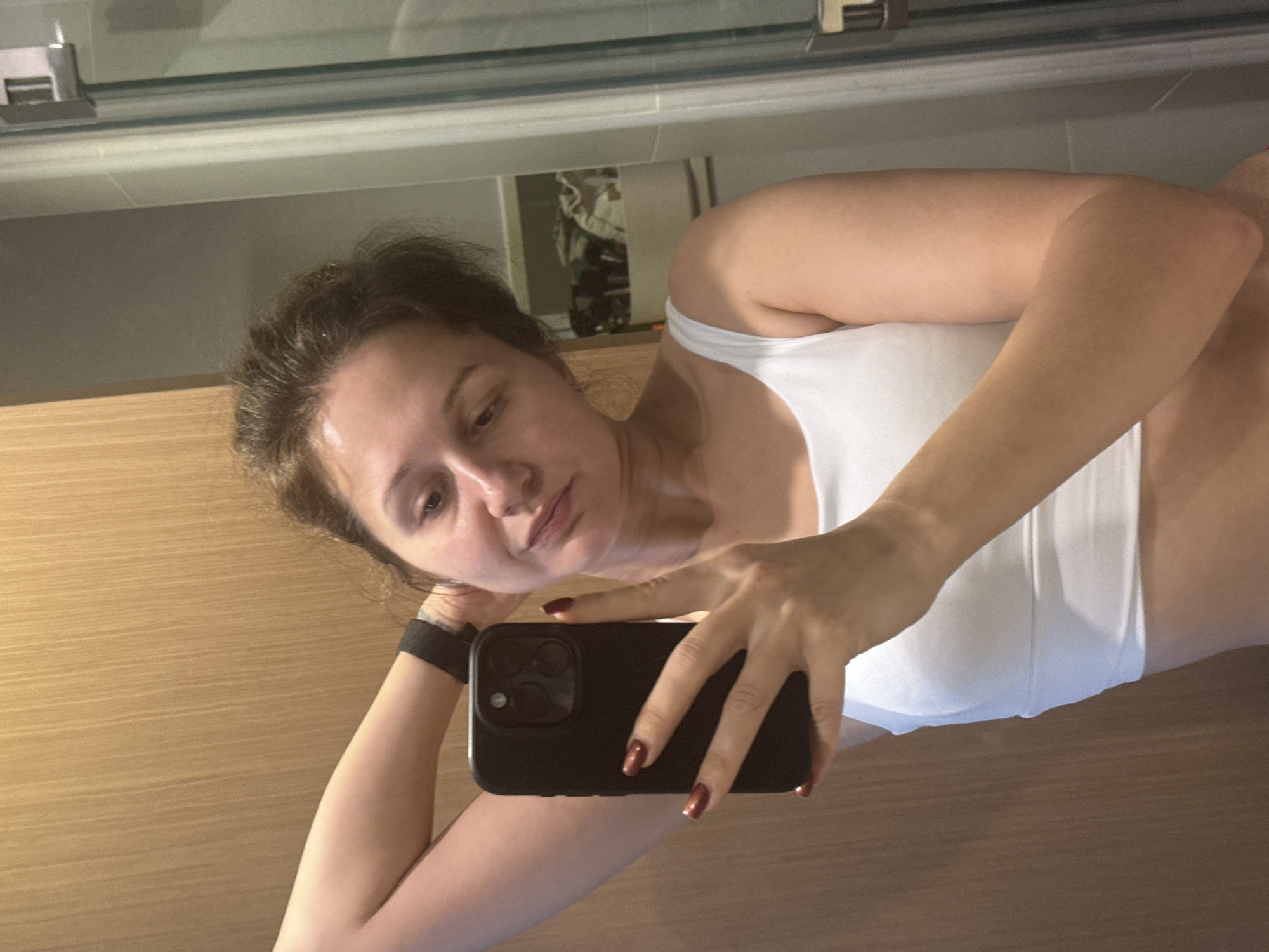 Woman takes bathroom selfie in Dubai early morning
