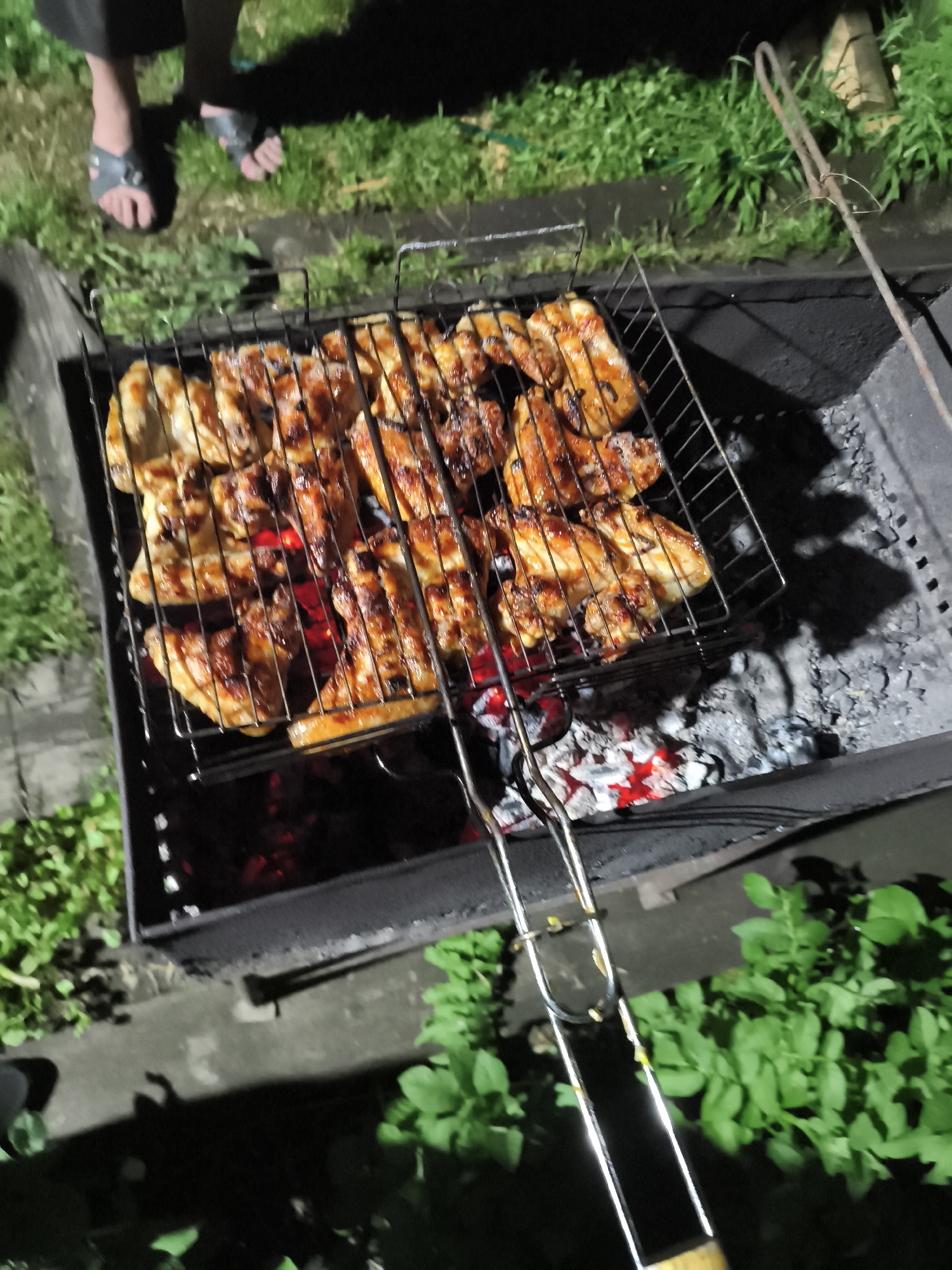 Evening barbecue gathering in Il'mino, Russia with grilled food