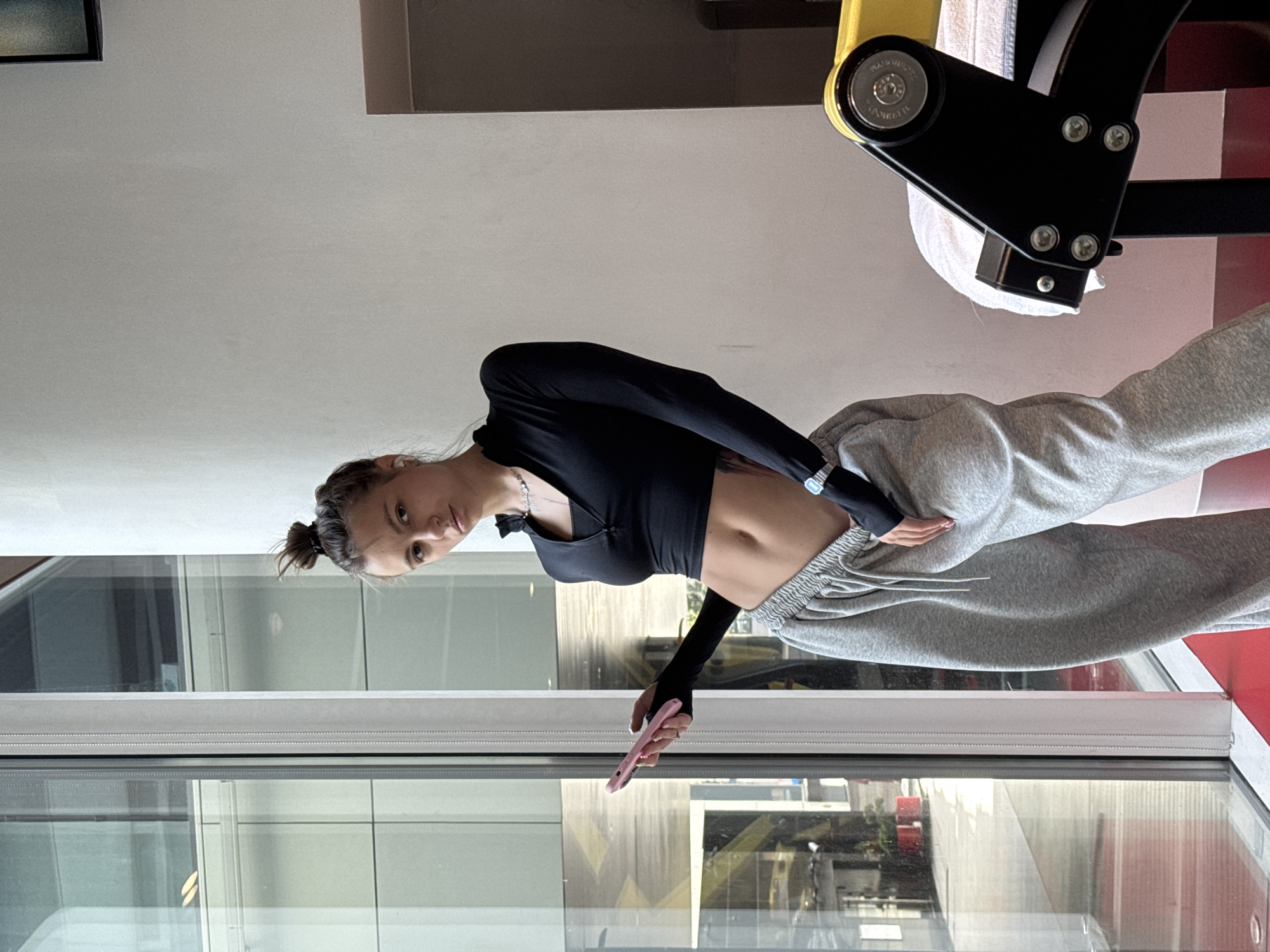Quick gym selfie series, casual poses near workout equipment.