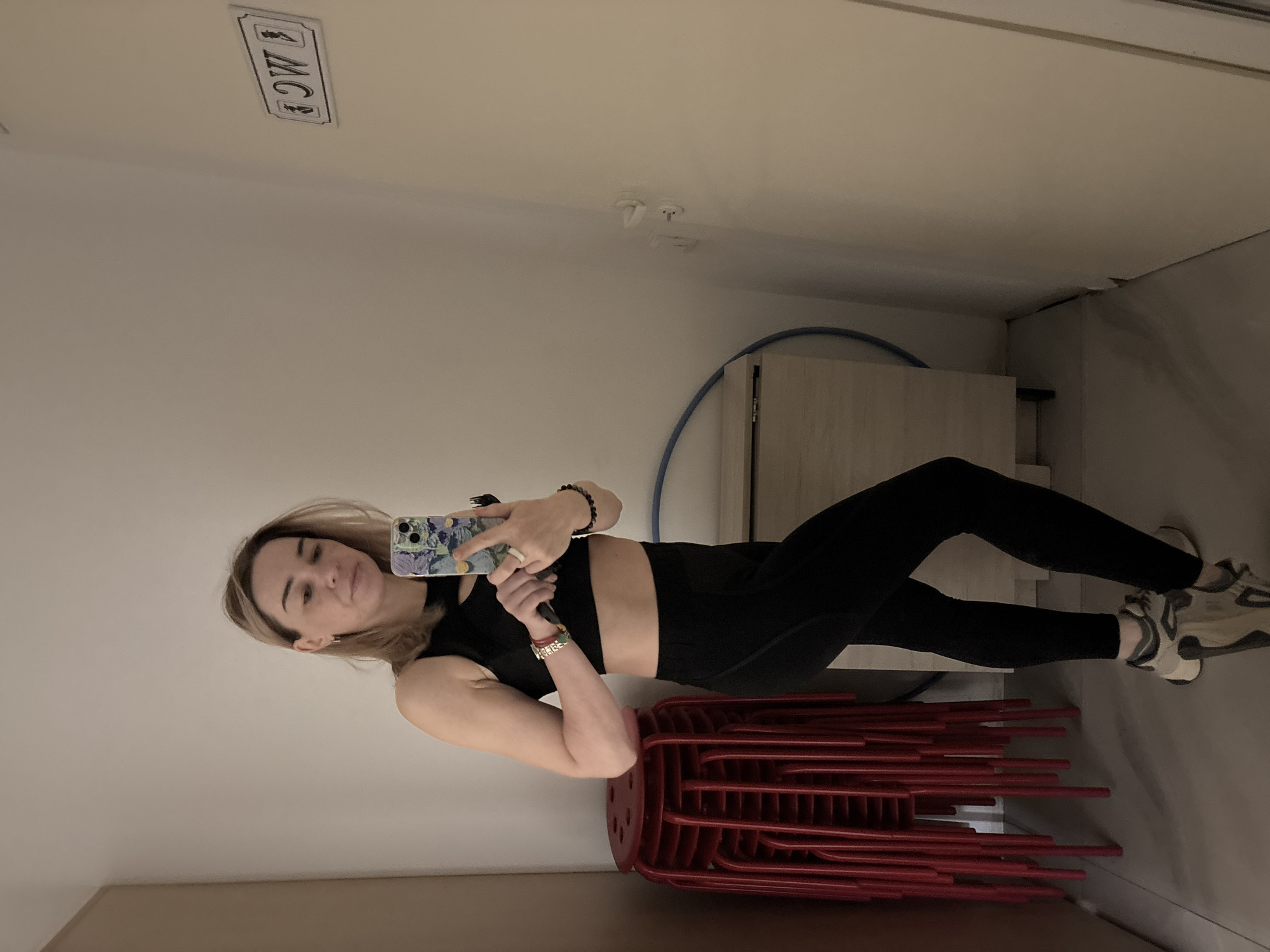 Woman Takes Selfies Standing on Chairs in Murino Restroom