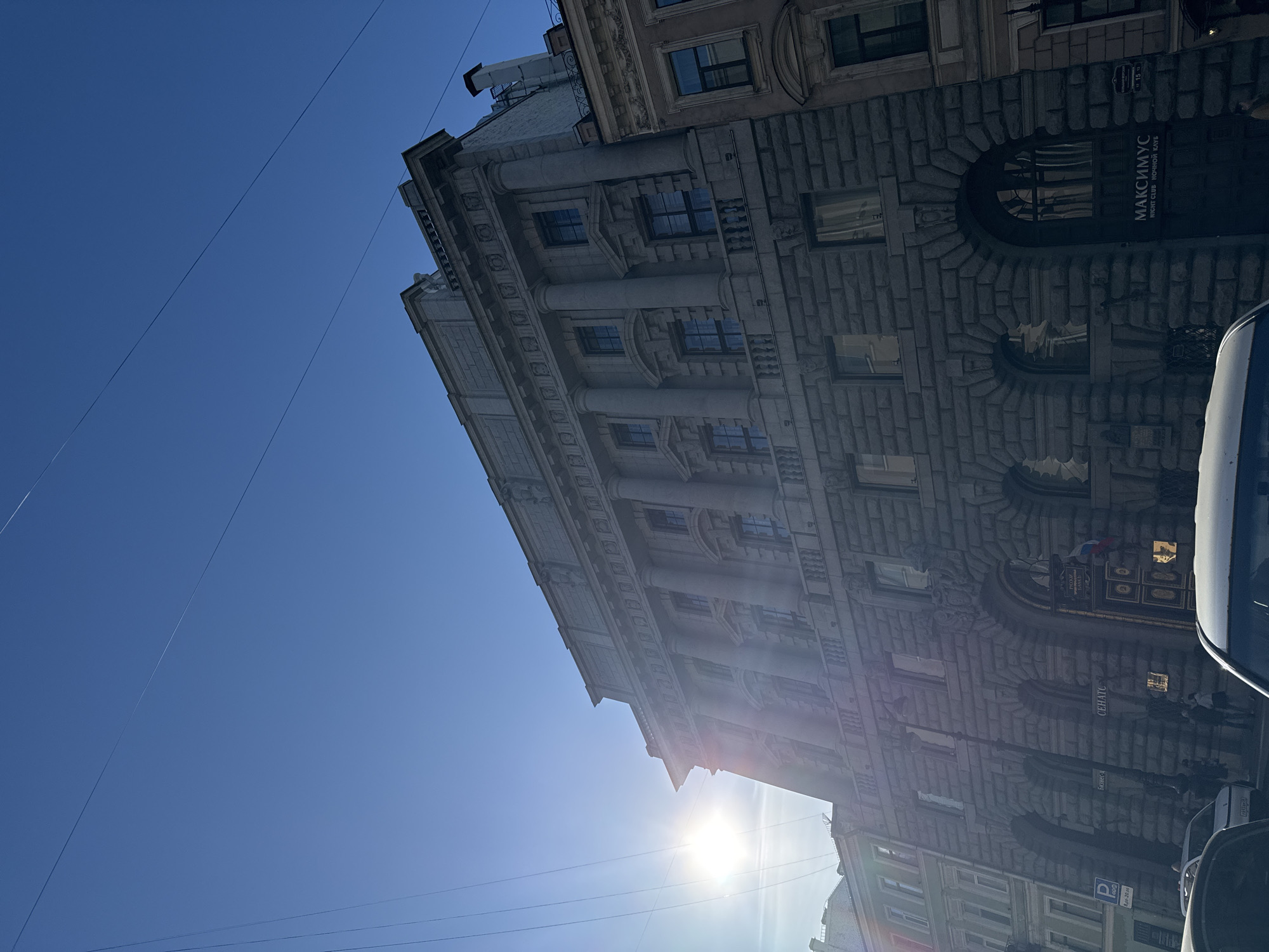 Tourists visit Saint Petersburg landmarks on sunny afternoon