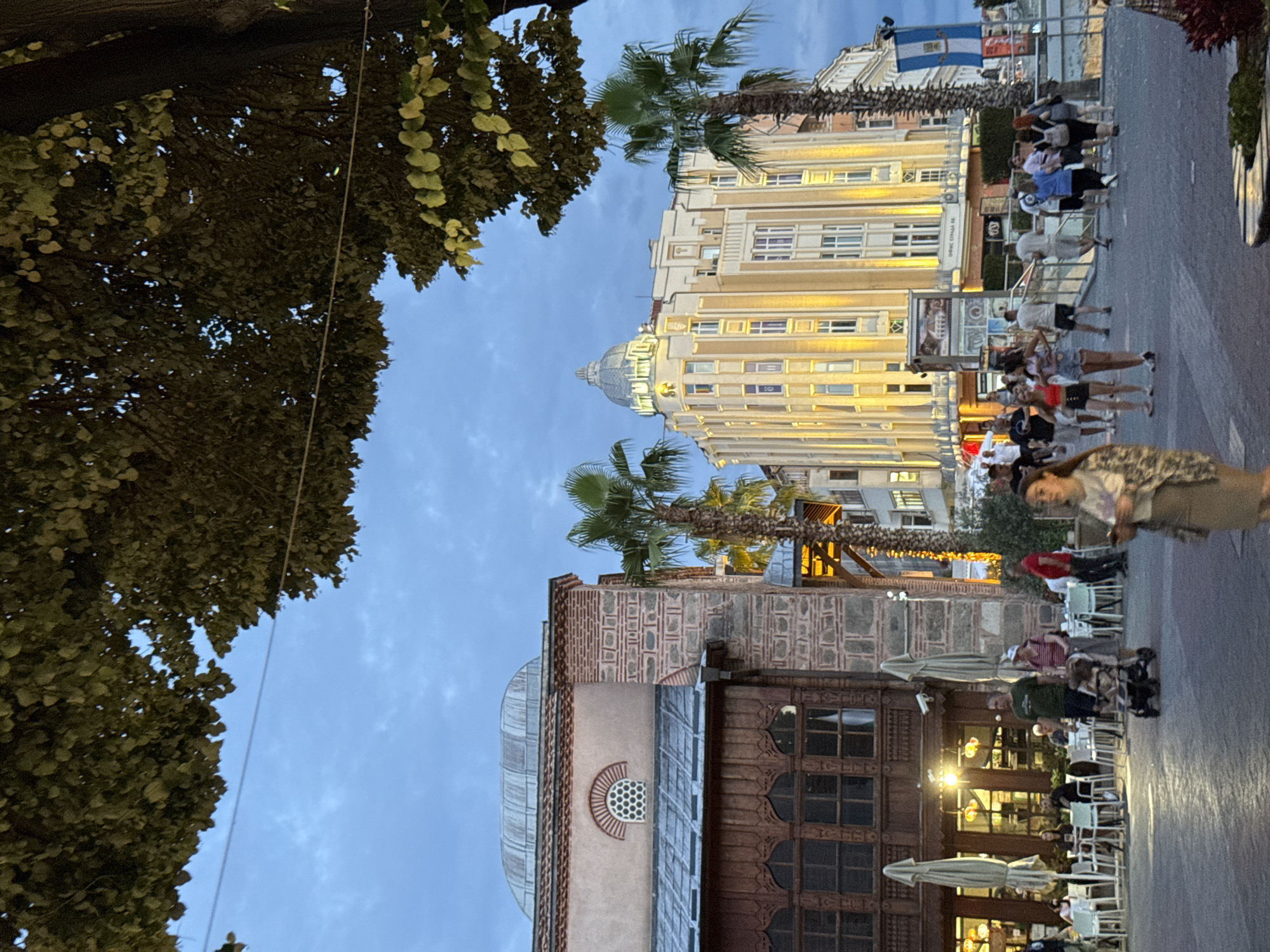 Plovdiv's pedestrian center at dusk, umbrella installation and landmarks