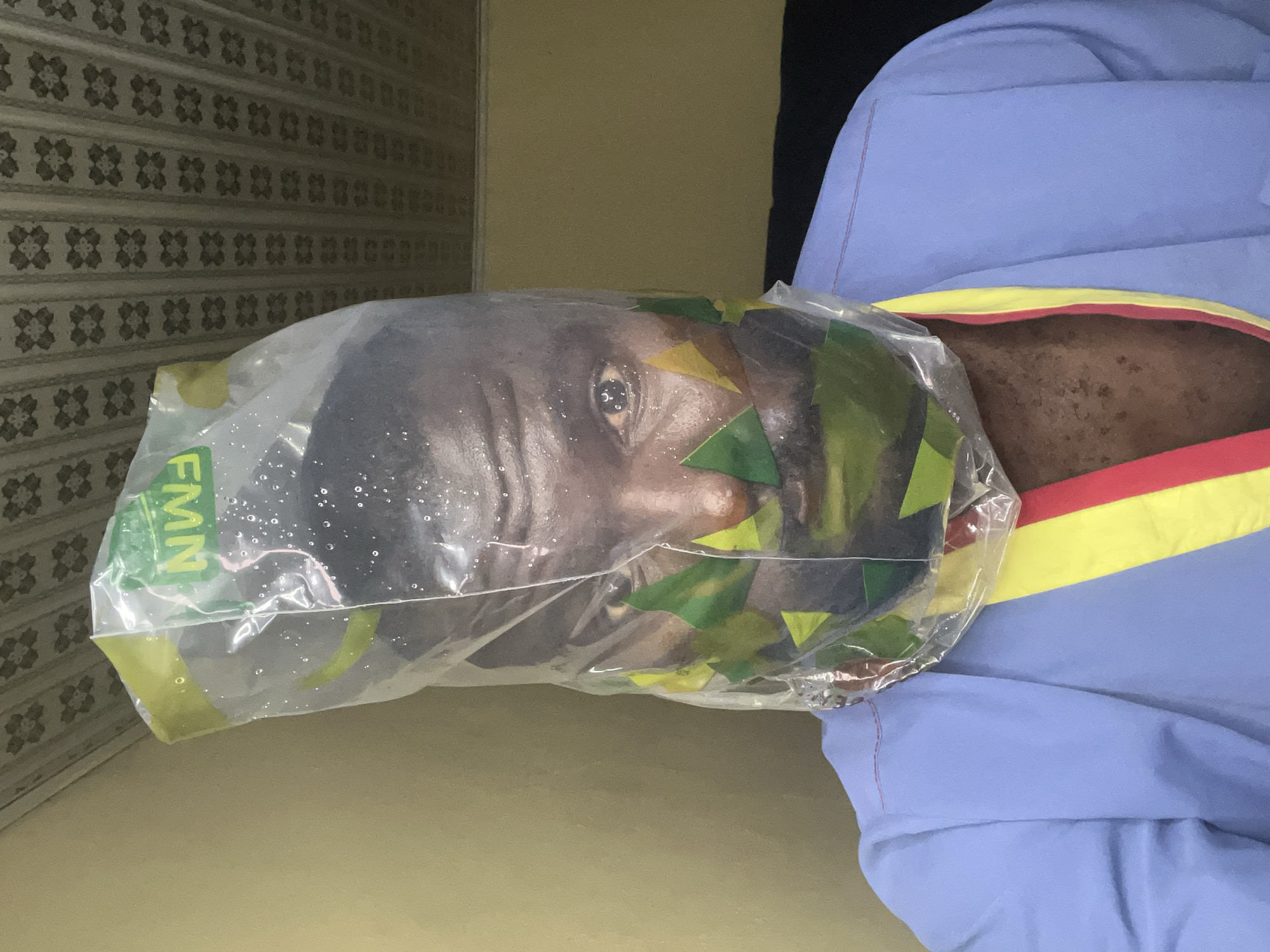 Man observed with plastic bag over head in Nigeria
