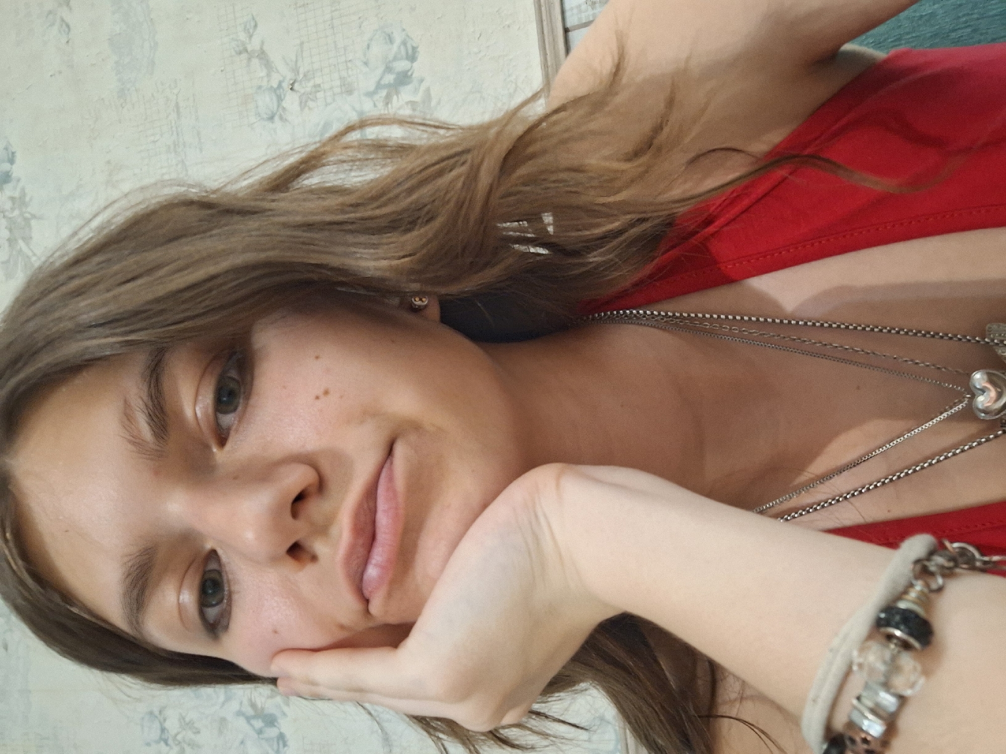 Woman takes selfies at Bulgarian cafe during midday visit