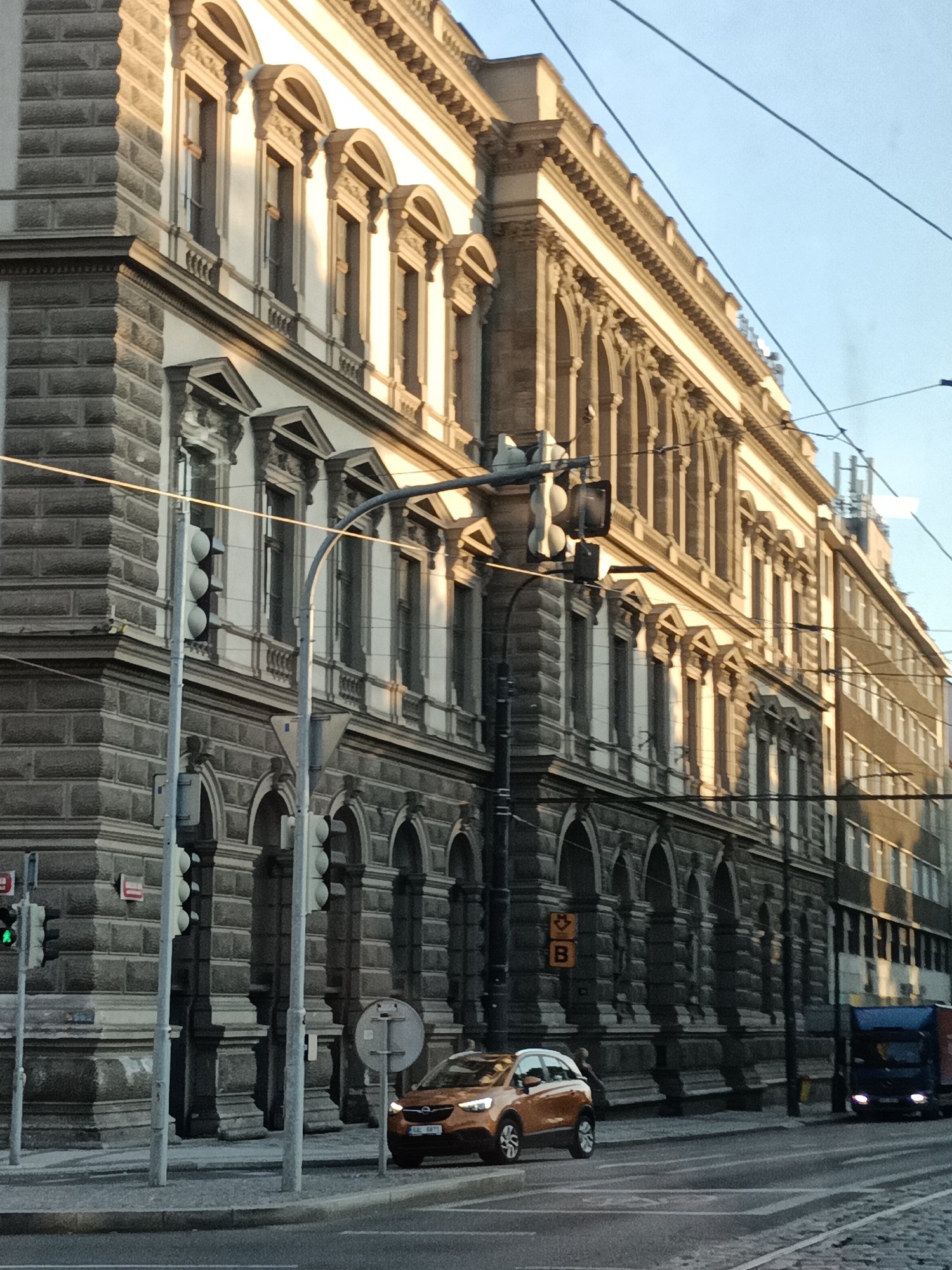 Prague trams rolling through classical streets at dawn