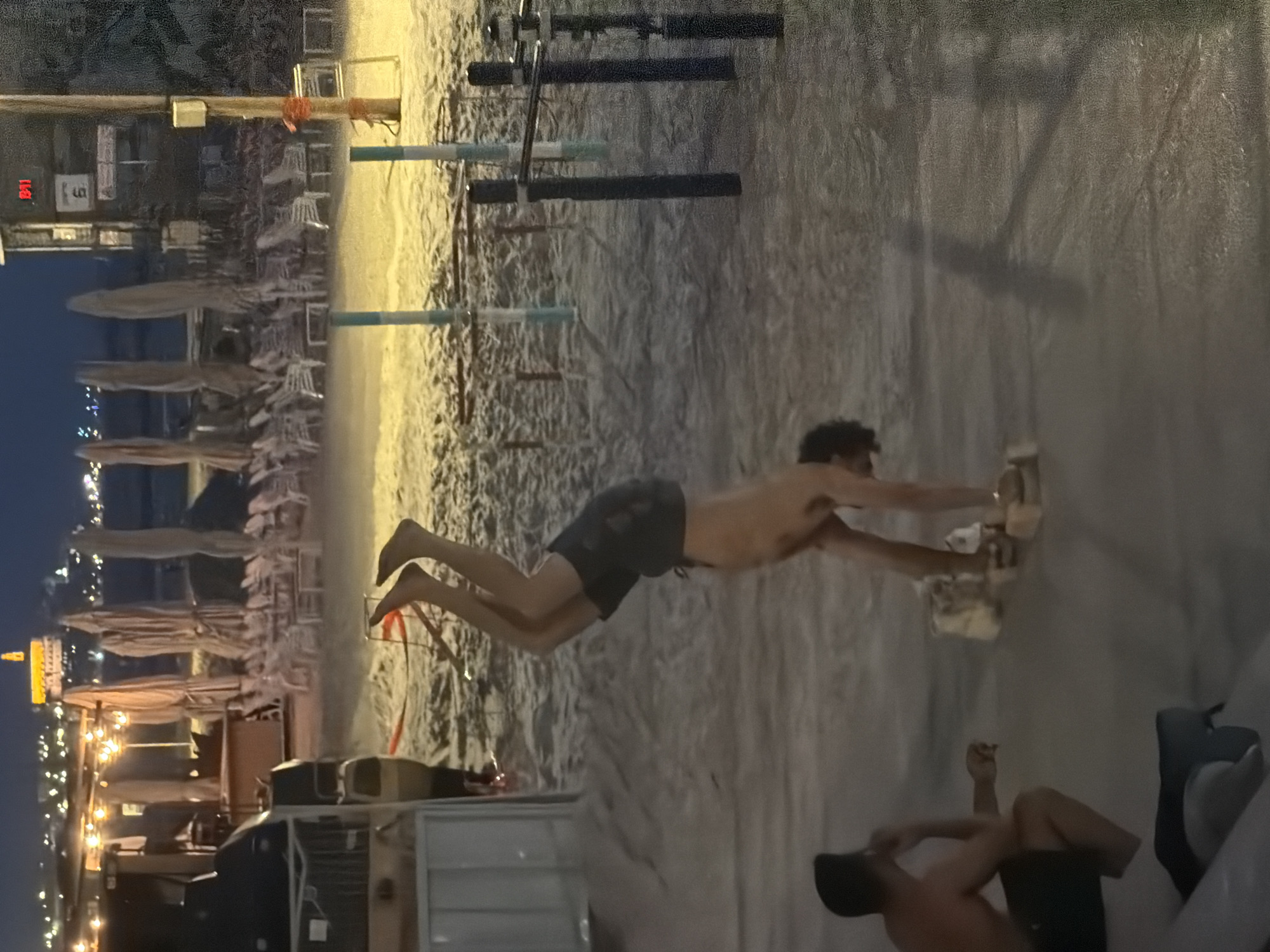 Tel Aviv beachfront captured at dusk with city skyline