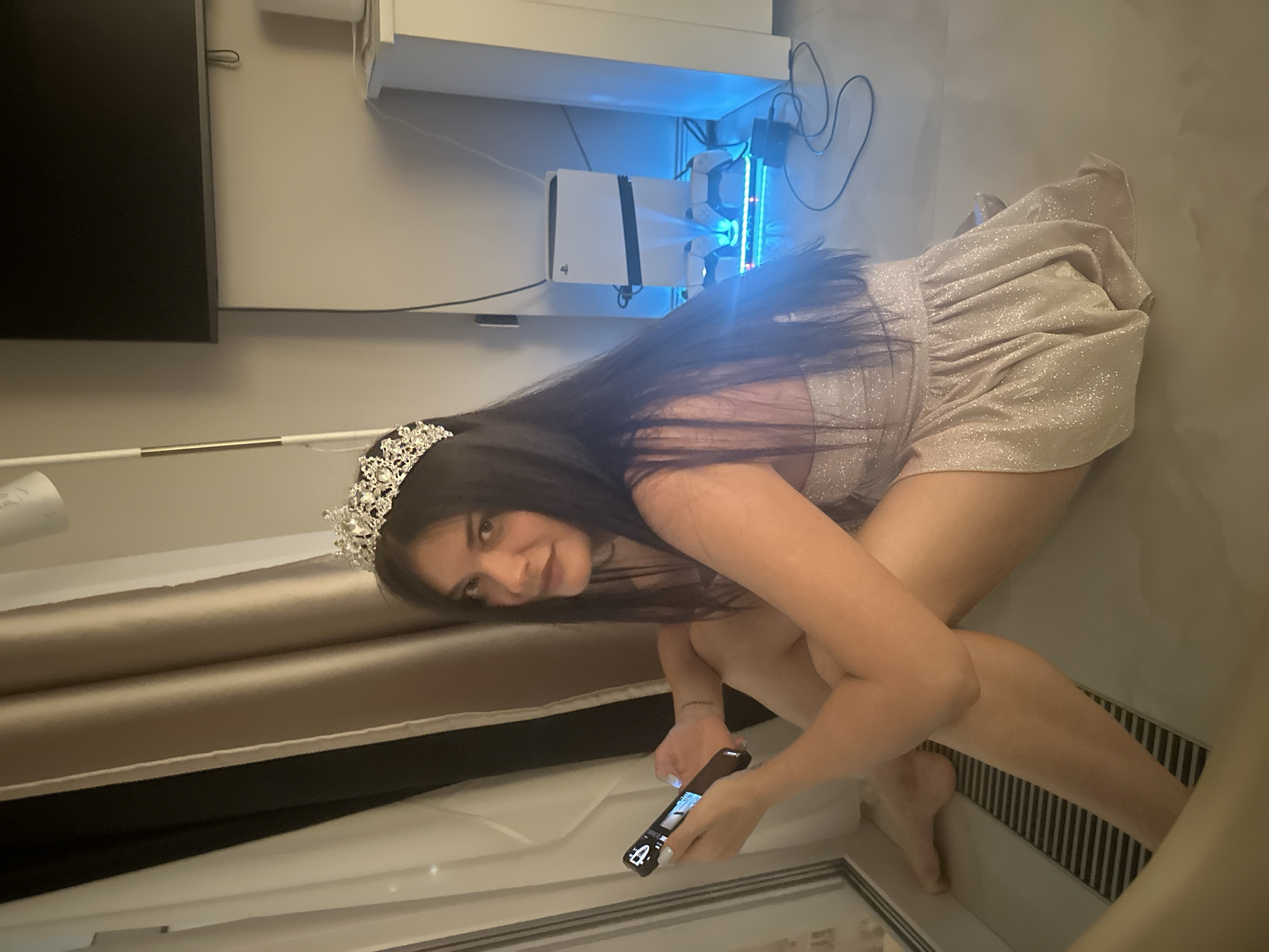 Woman in tiara and sparkly dress photographed in Russia