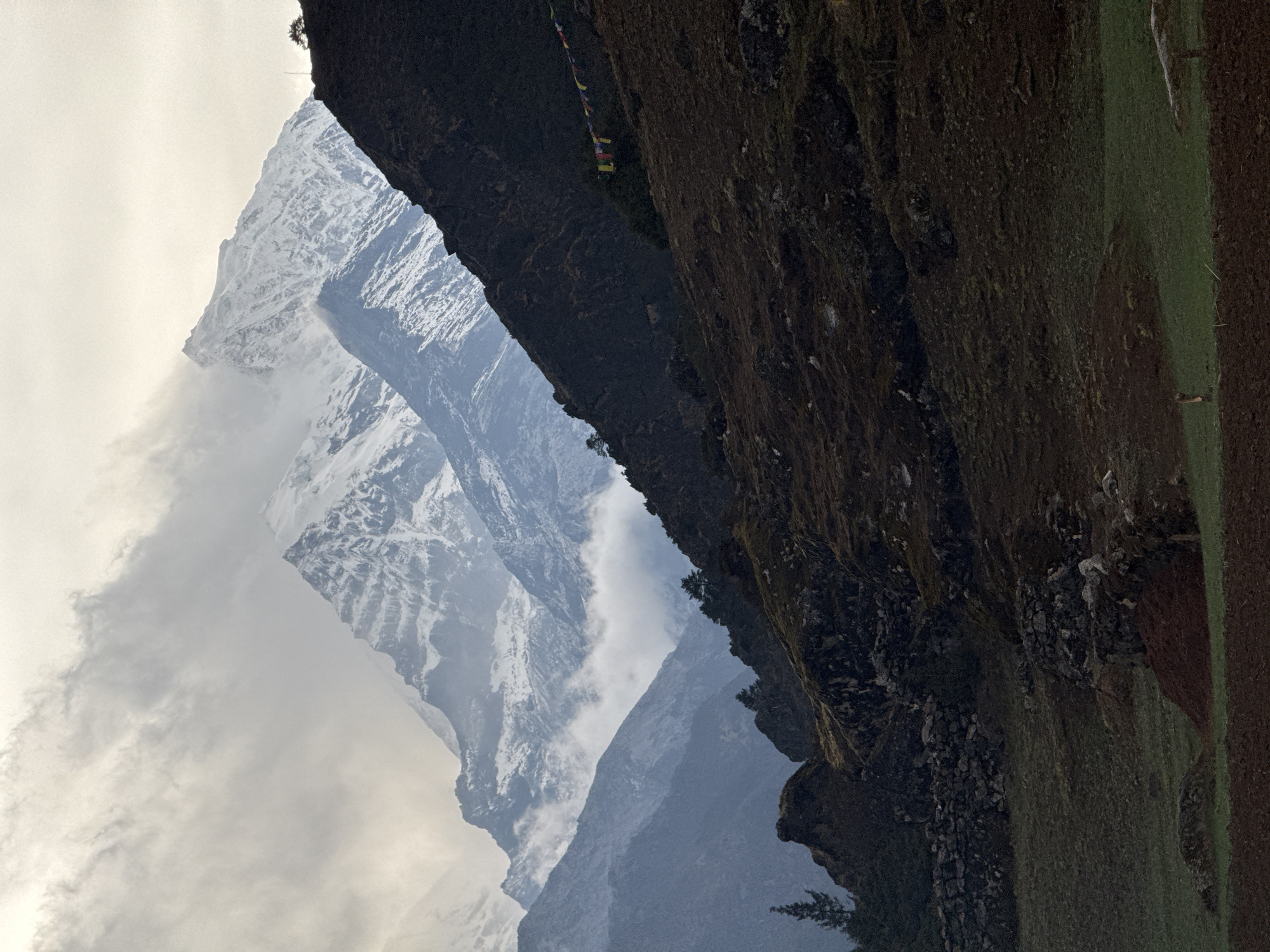 Mountain vista with prayer flags observed in Namche, Nepal