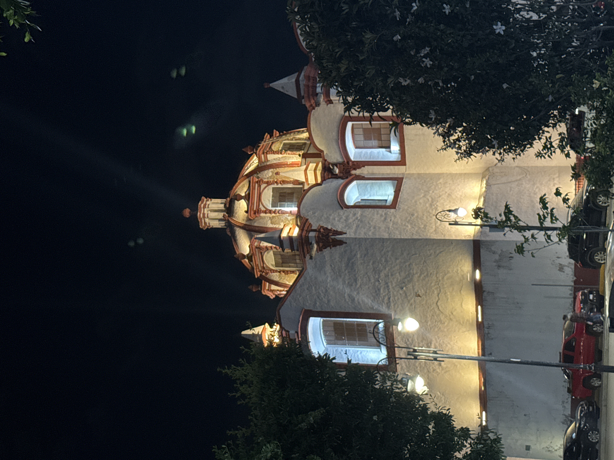 Church building photographed at night in Cholula, Mexico