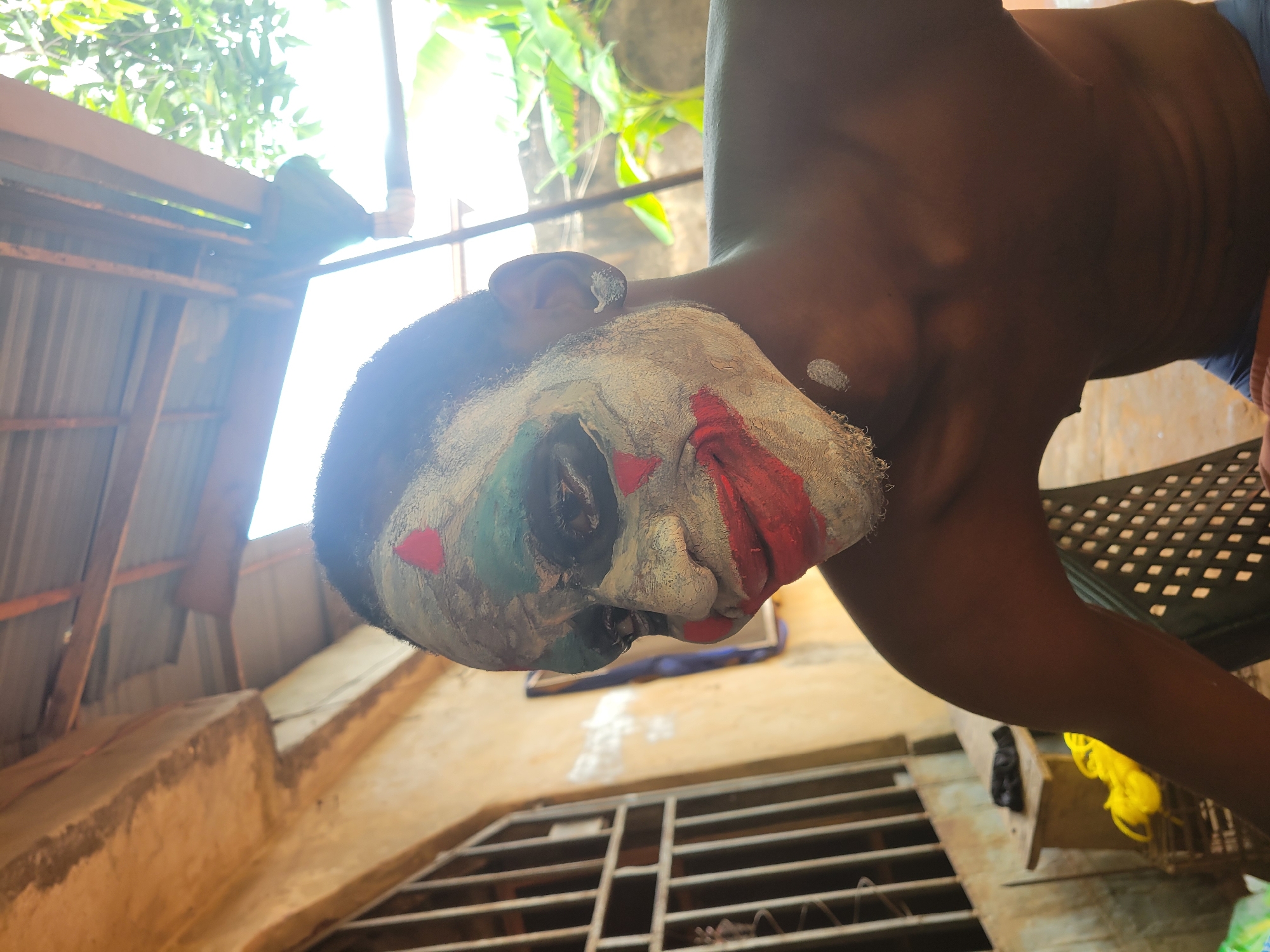 Person in colorful face paint and costume captured