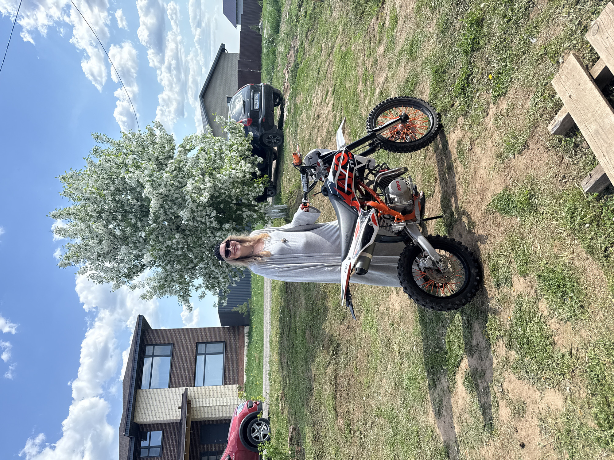 Two people pose with dirt bike in Izhevsk