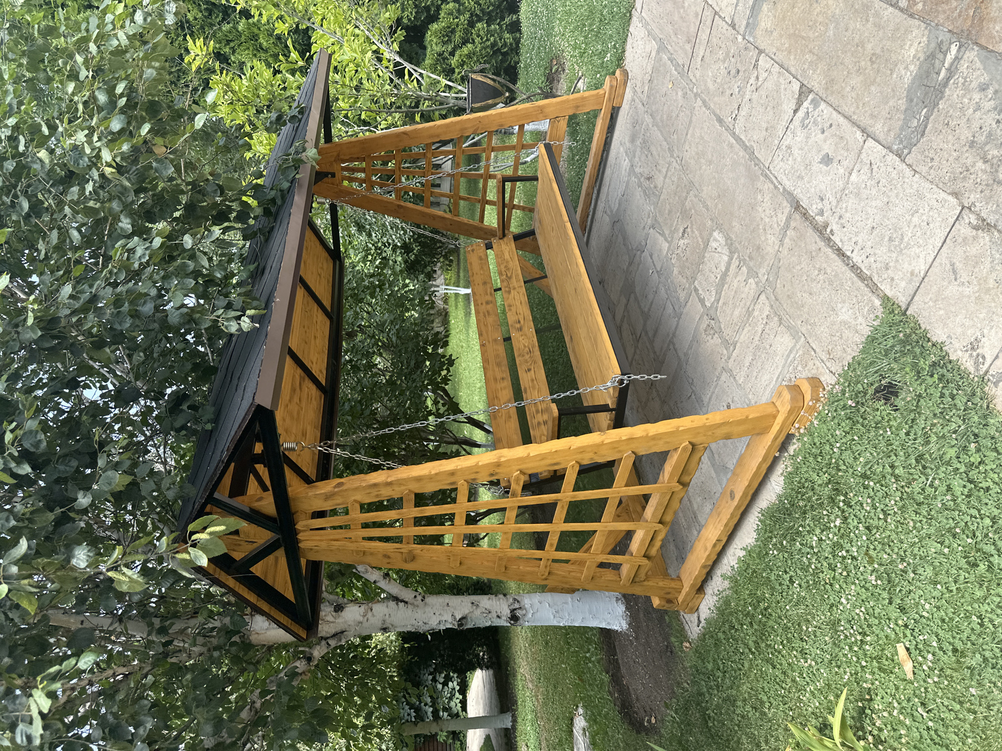 Lush garden scenes: whitewashed trees, swing set, and lily pond