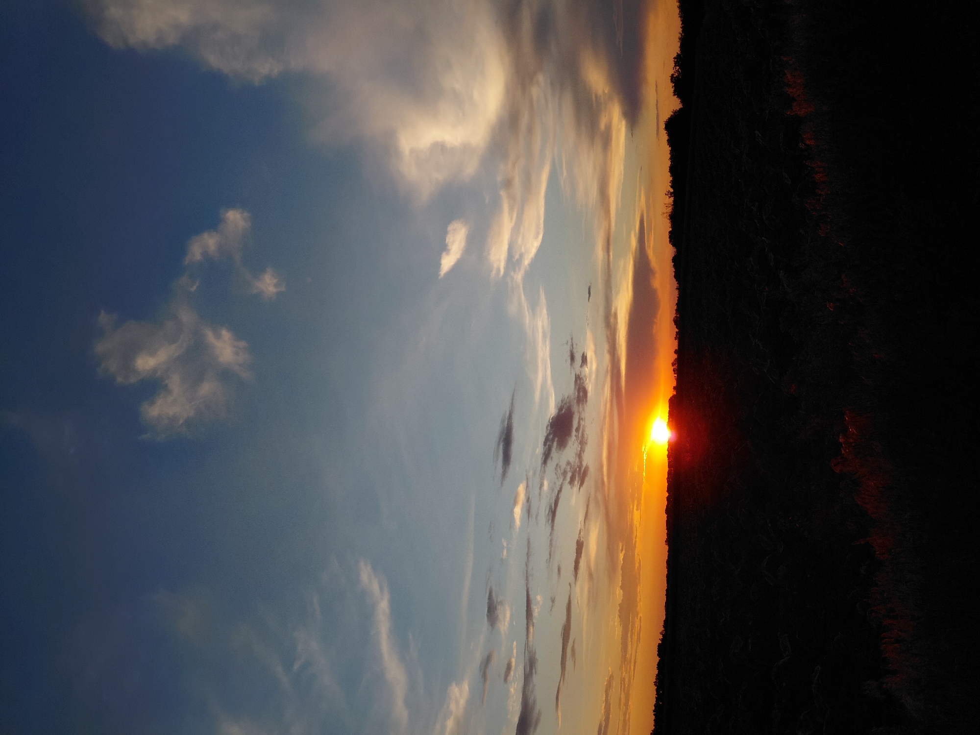 Golden hour sunset documented across Ukrainian countryside fields