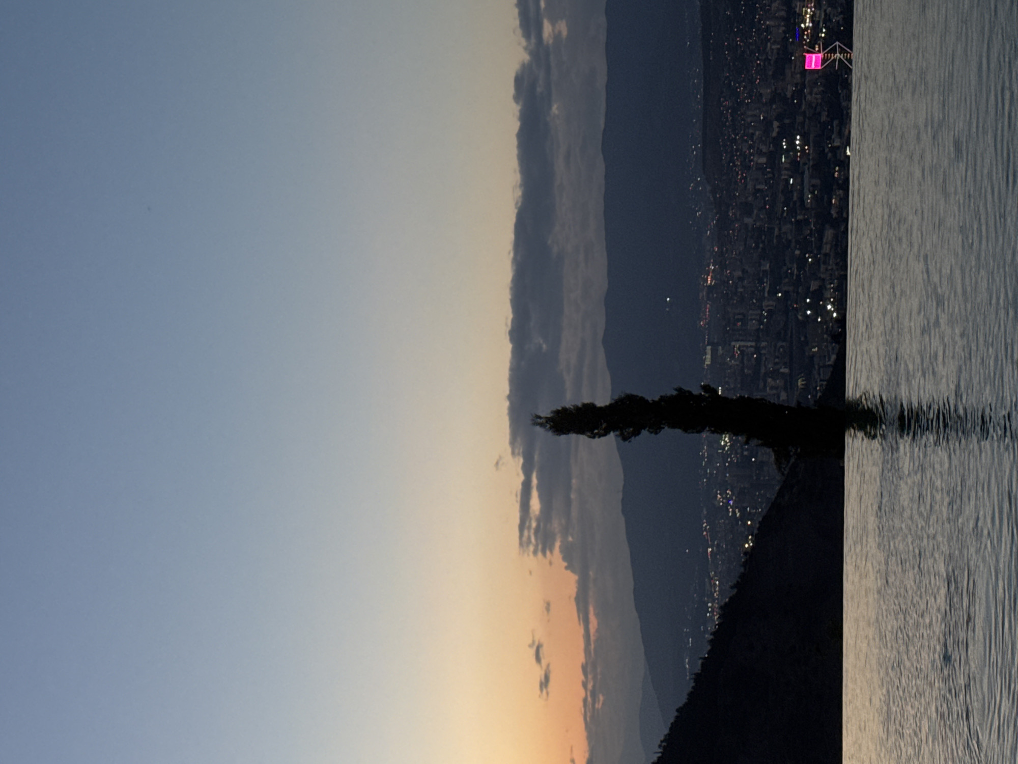 Rooftop infinity pool evening in Tbilisi with city views