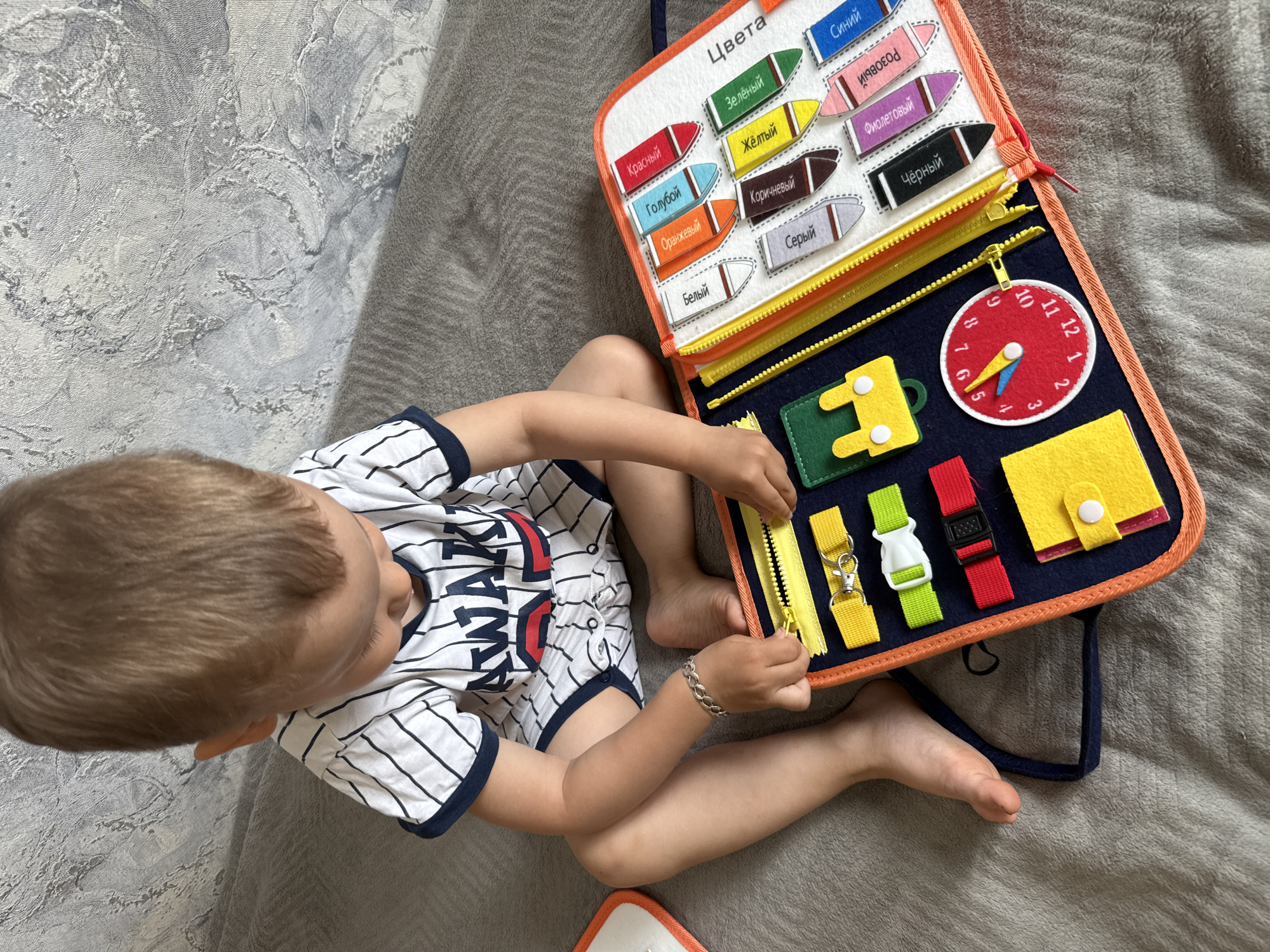 Child plays with educational toys during early morning in Russia