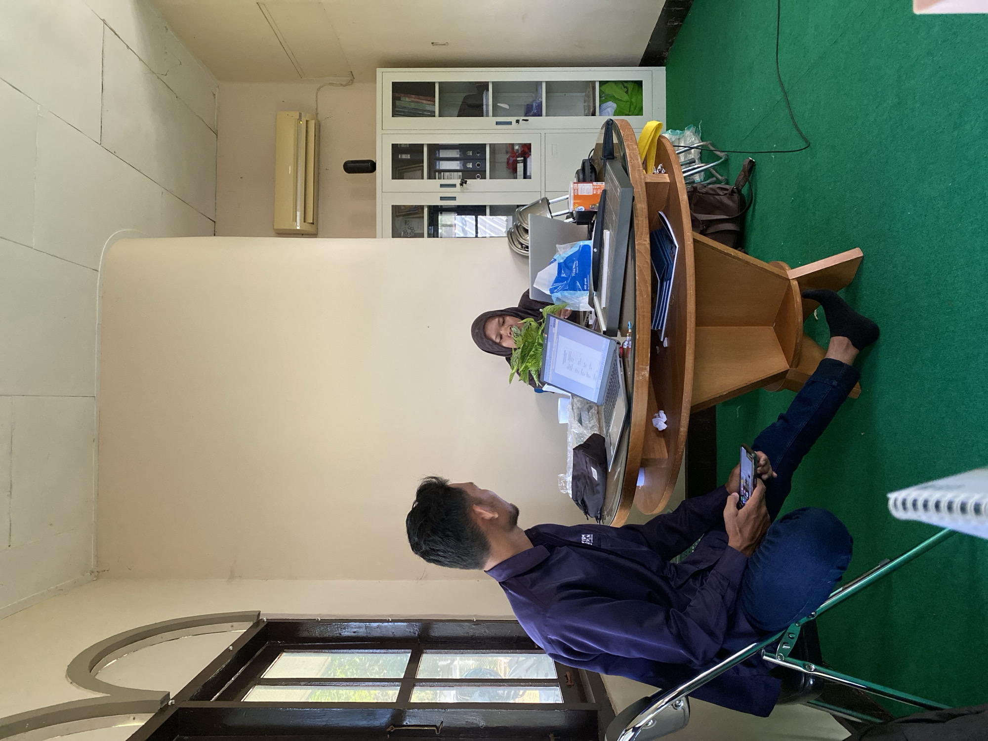 Casual office gathering in Banjarbaru, mid-work moment