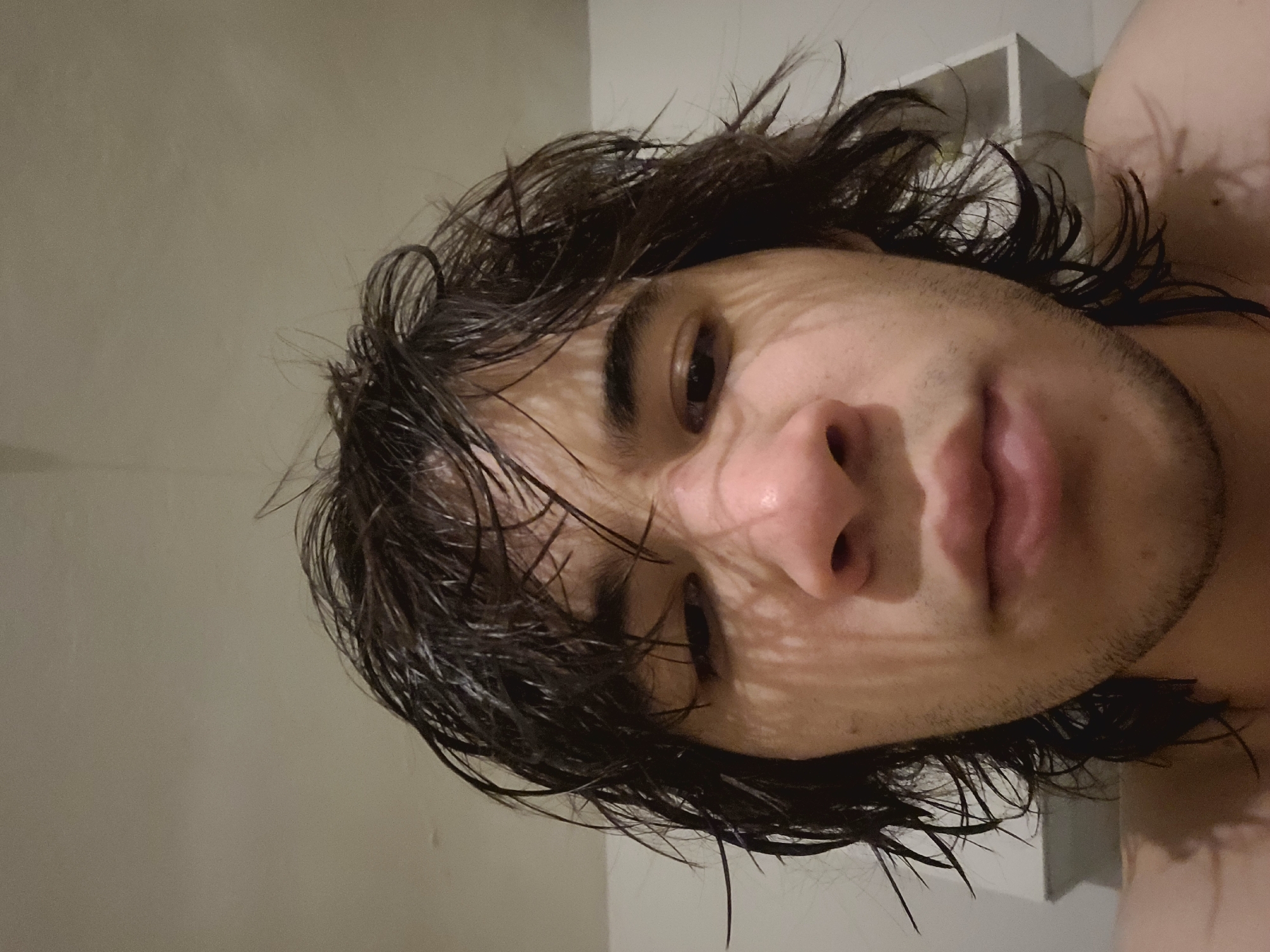 Portrait captured in Catamarca shows young man with wet hair