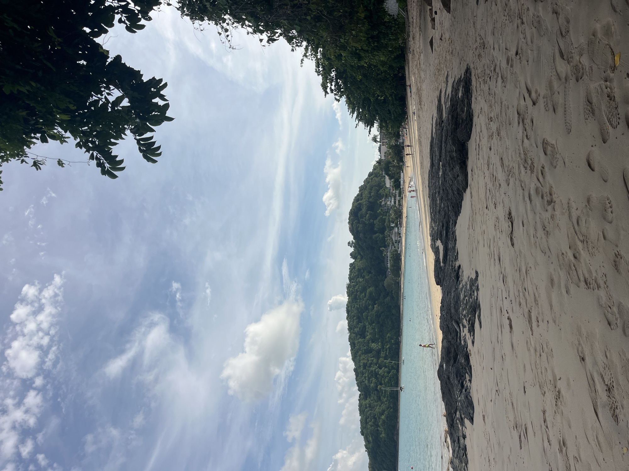 Beach day with swimming, sandcastles, and street food vendors