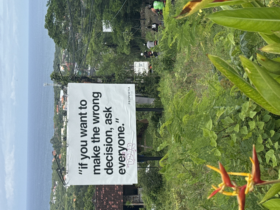 Real estate sign with motivational message spotted in Pecatu