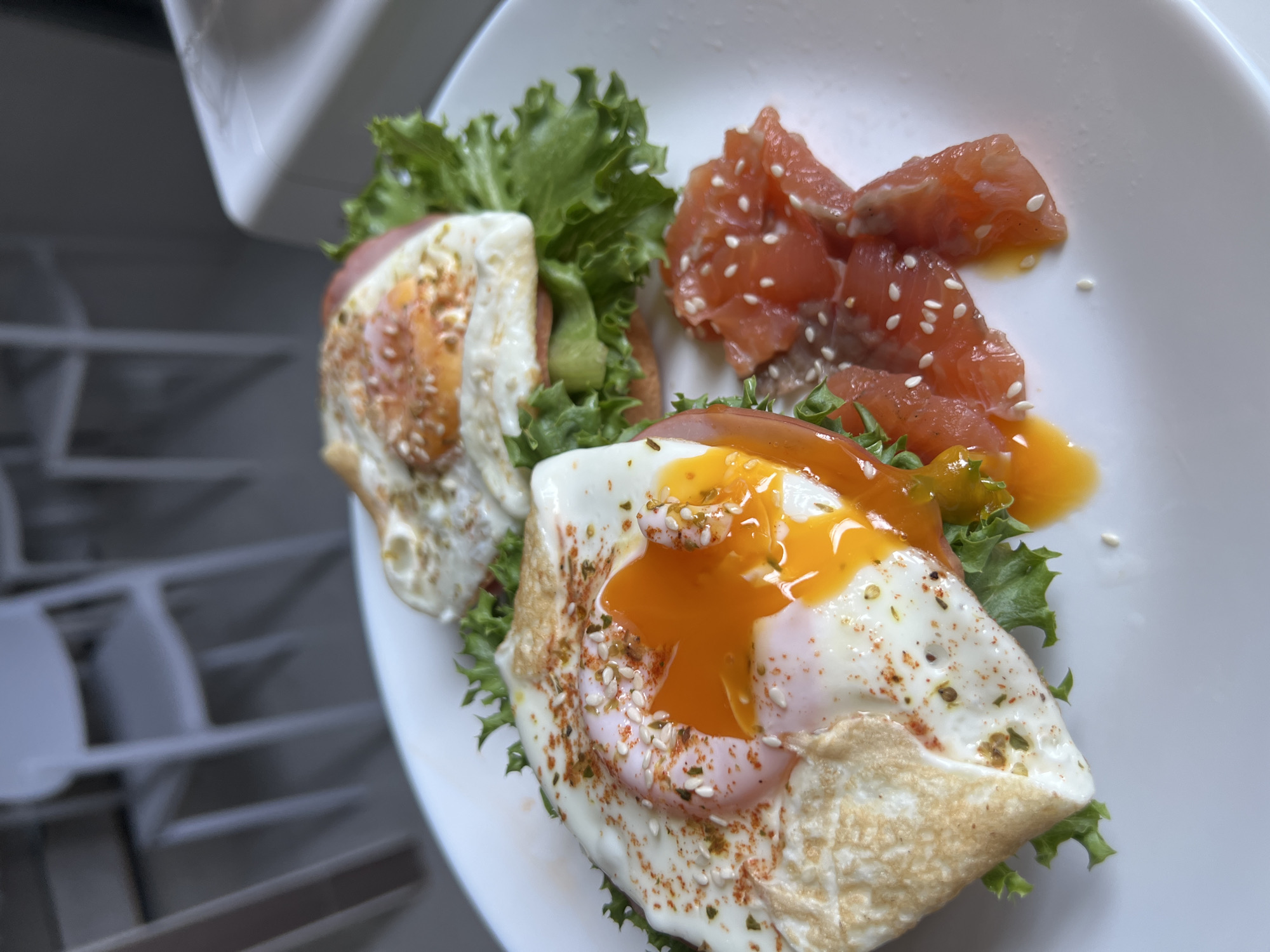 Egg and ham open-faced sandwiches at a Choeng Thale breakfast table