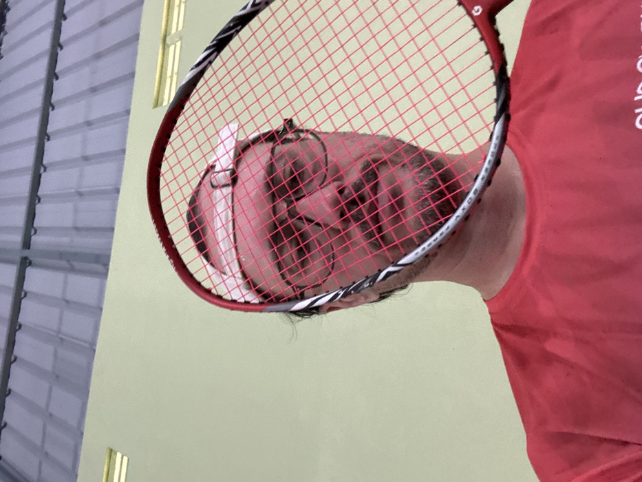 Late-night badminton game recorded at Indonesian gymnasium