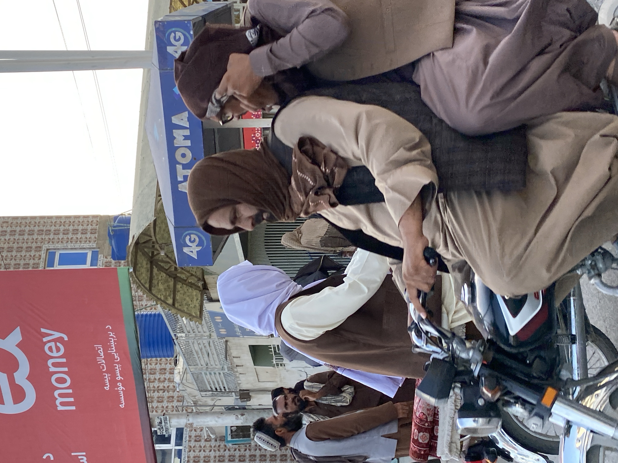 Street activity in Kandahar's market district, midday