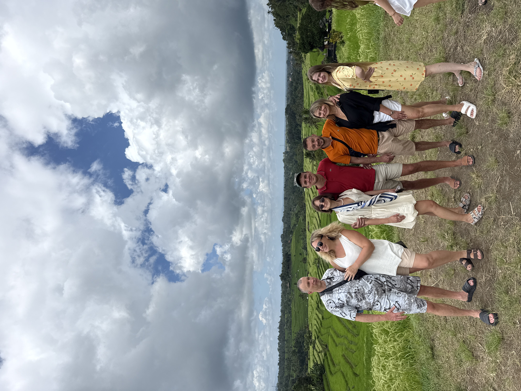Seven people pose for photo amid rice terraces in Penebel