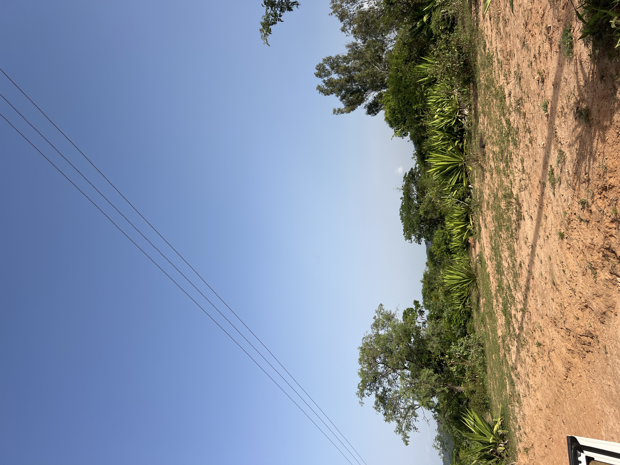 People photographing rural landscape in Fobur, Nigeria