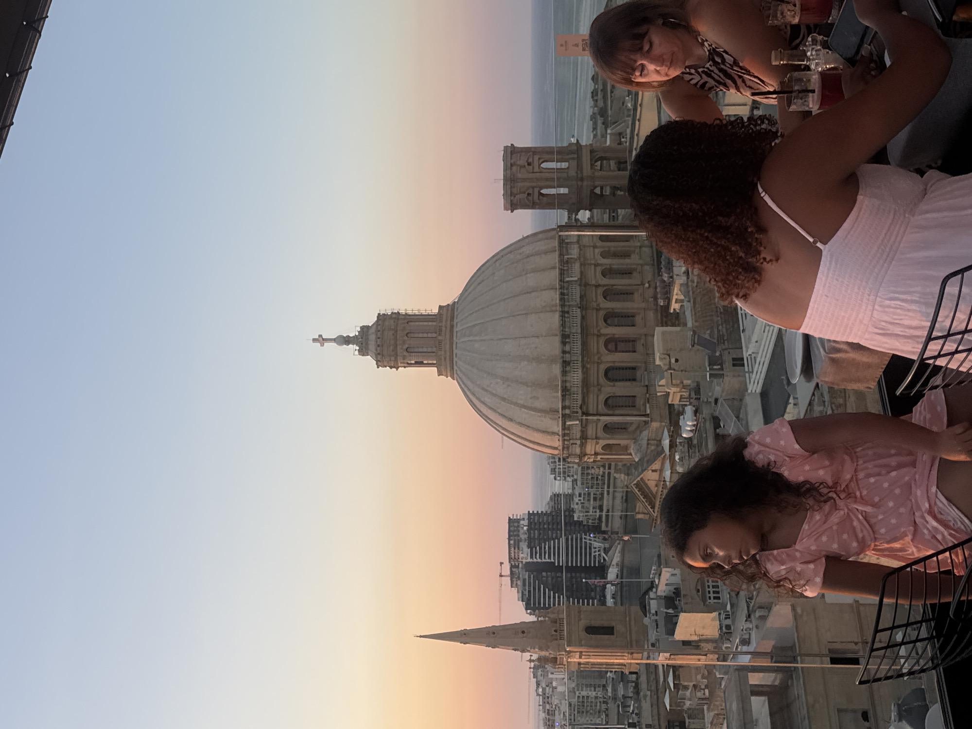 Rooftop sunset views over Valletta from a poolside setting