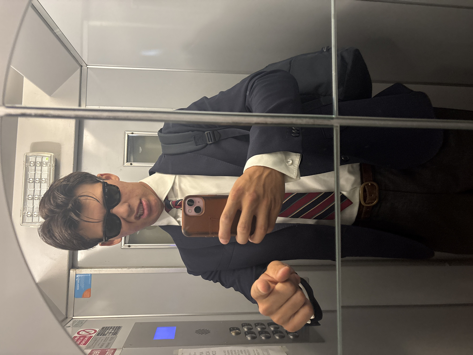 Elevator selfie in Milan, suited up and ready to go