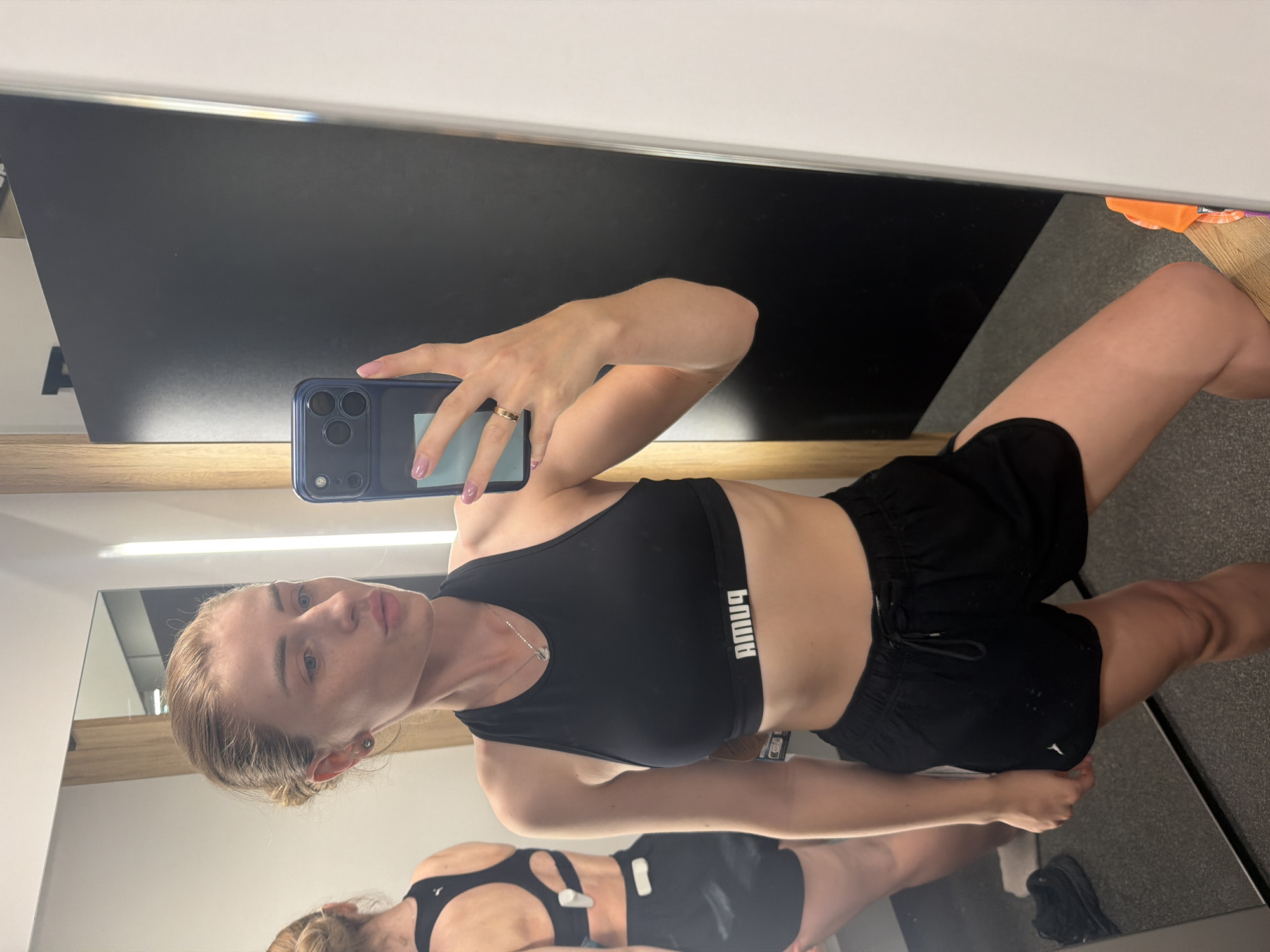 Gym workout session with multiple mirror selfies