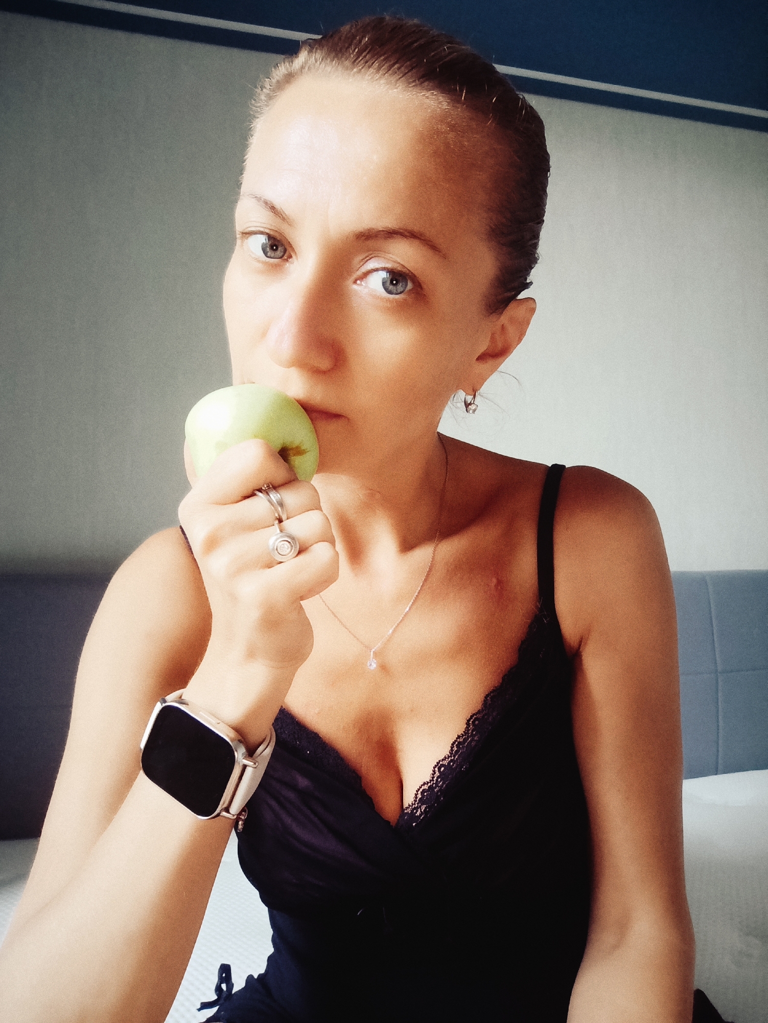 Indoor portrait session with a green apple, Moscow