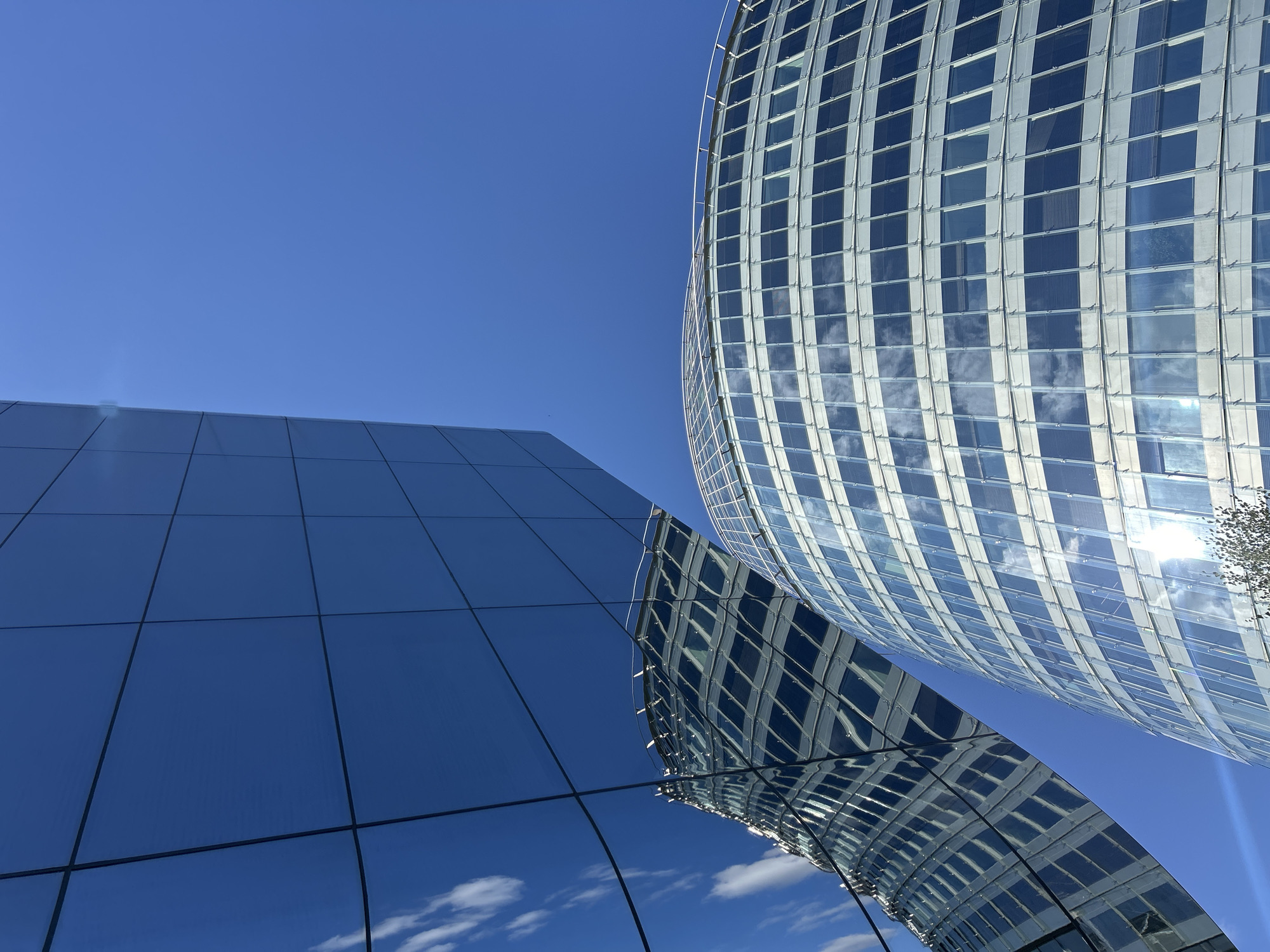 Green Hall business complex gleams under clear Vilnius skies