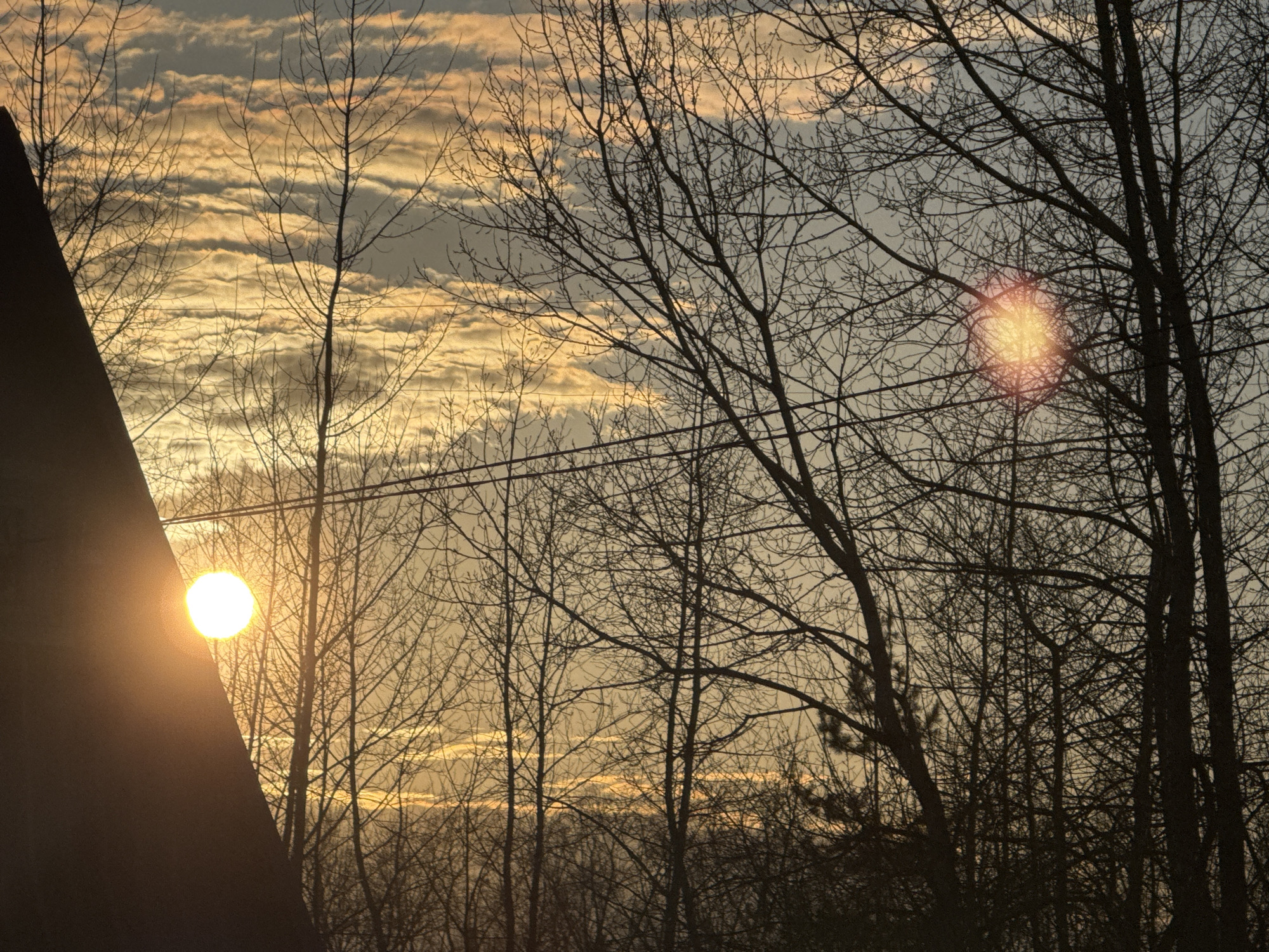 Sunset scenes documented in Chaikovsky, Russia during spring evening