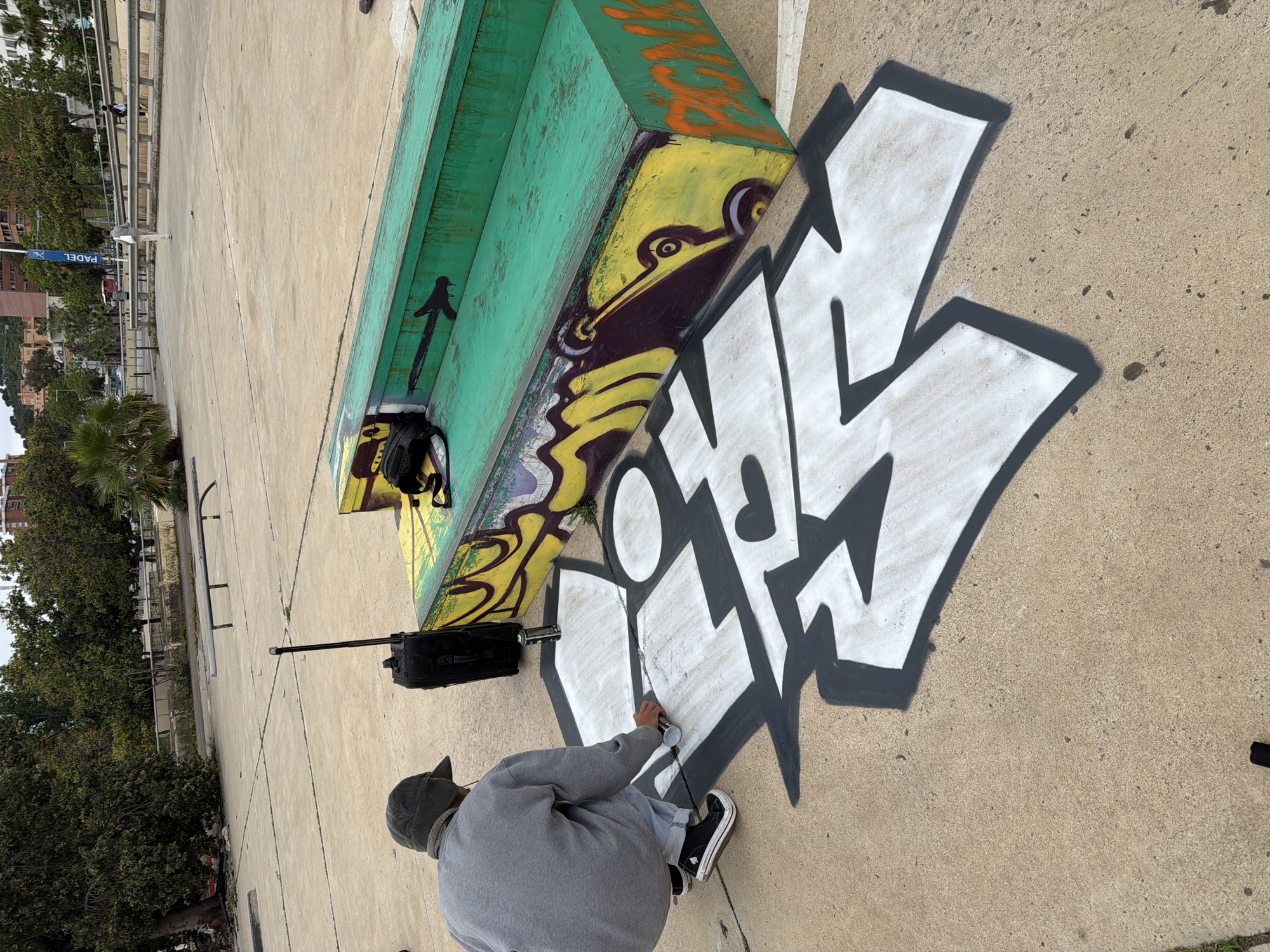 Morning scenes across Barcelona: graffiti, rooftop observer, escalator maintenance