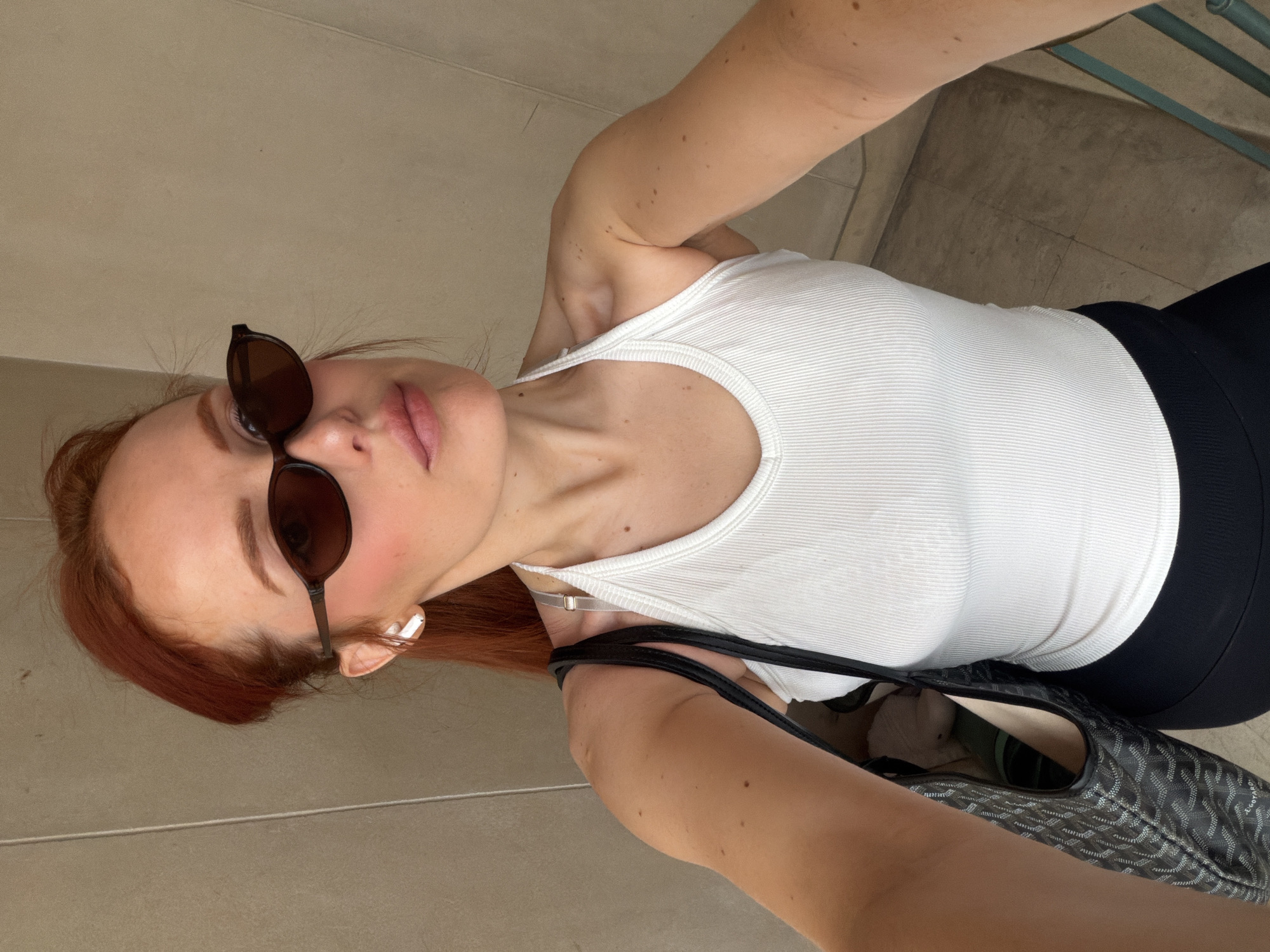 Woman poses for selfie in Paris morning