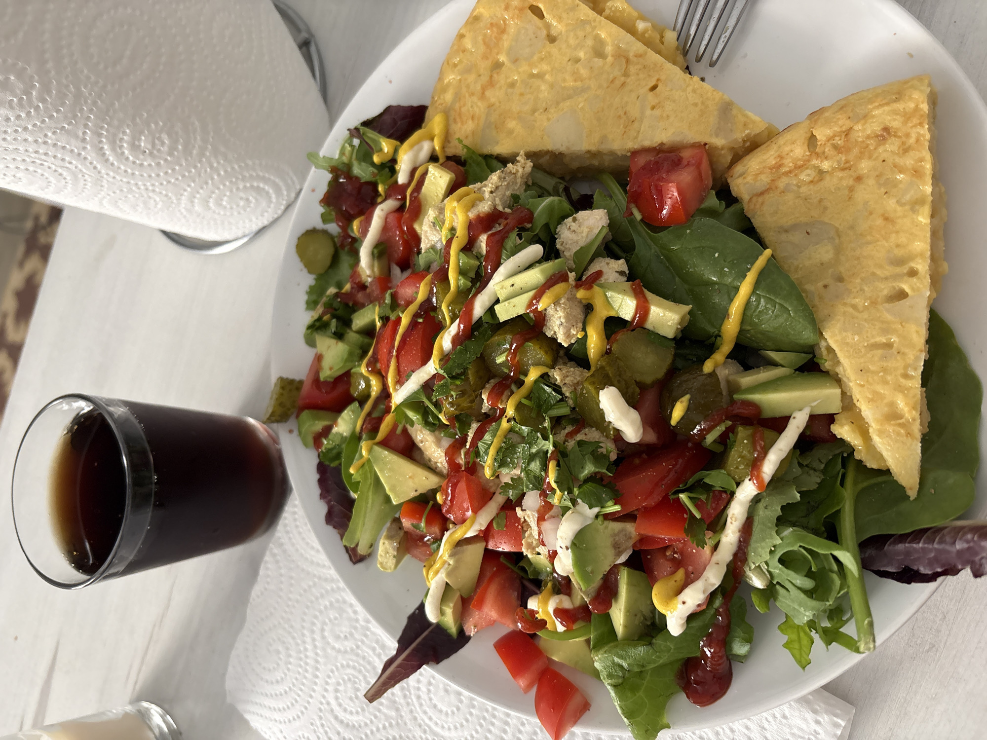 Traditional Spanish tortilla served with fresh salad in Barcelona