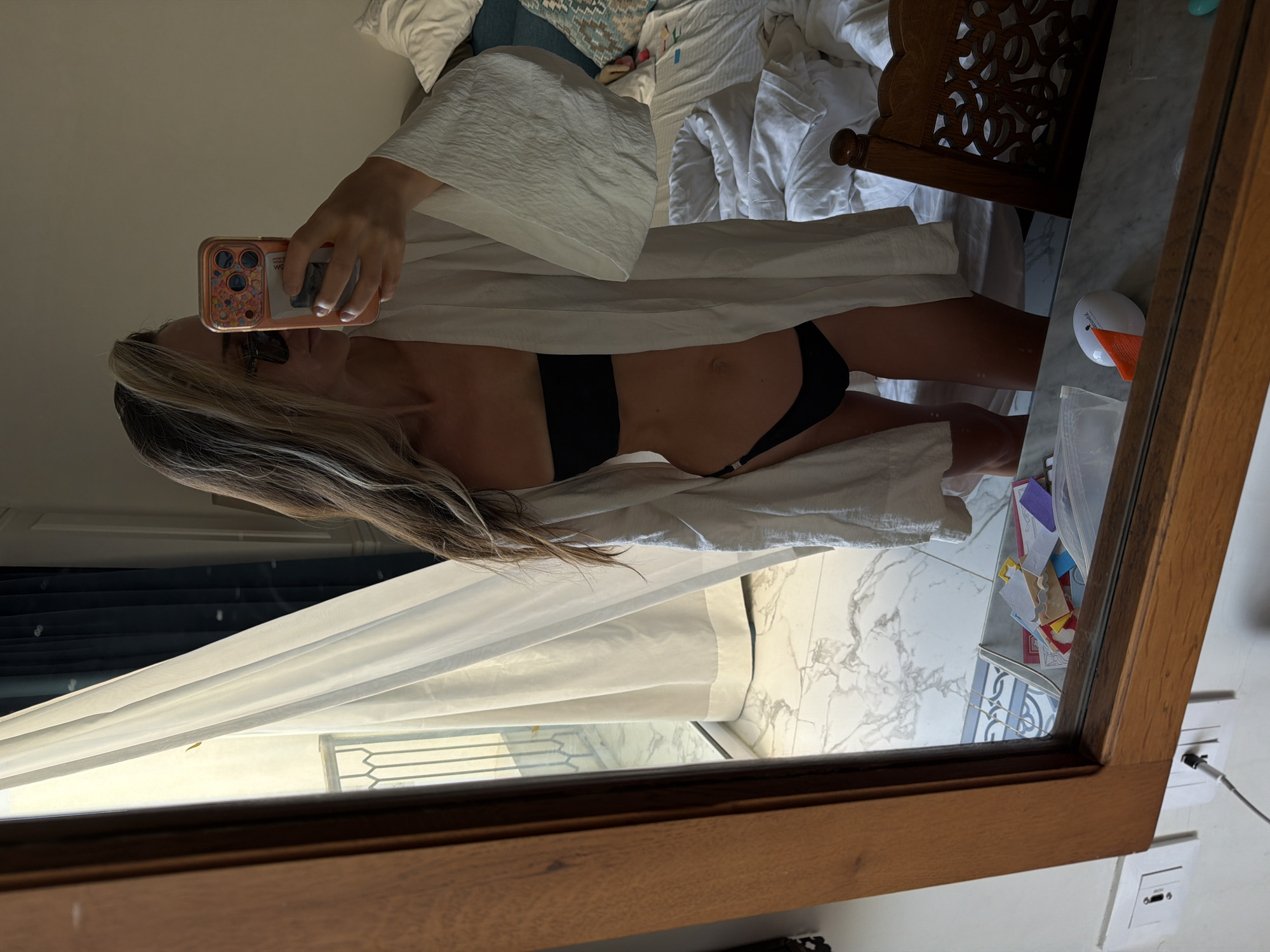Woman takes mirror selfie in Sharm El Sheikh indoor setting