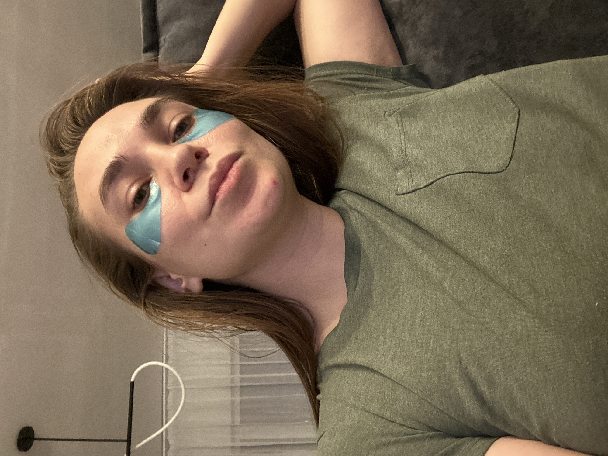 Woman rests with eye patches in Kharnavy, Russia