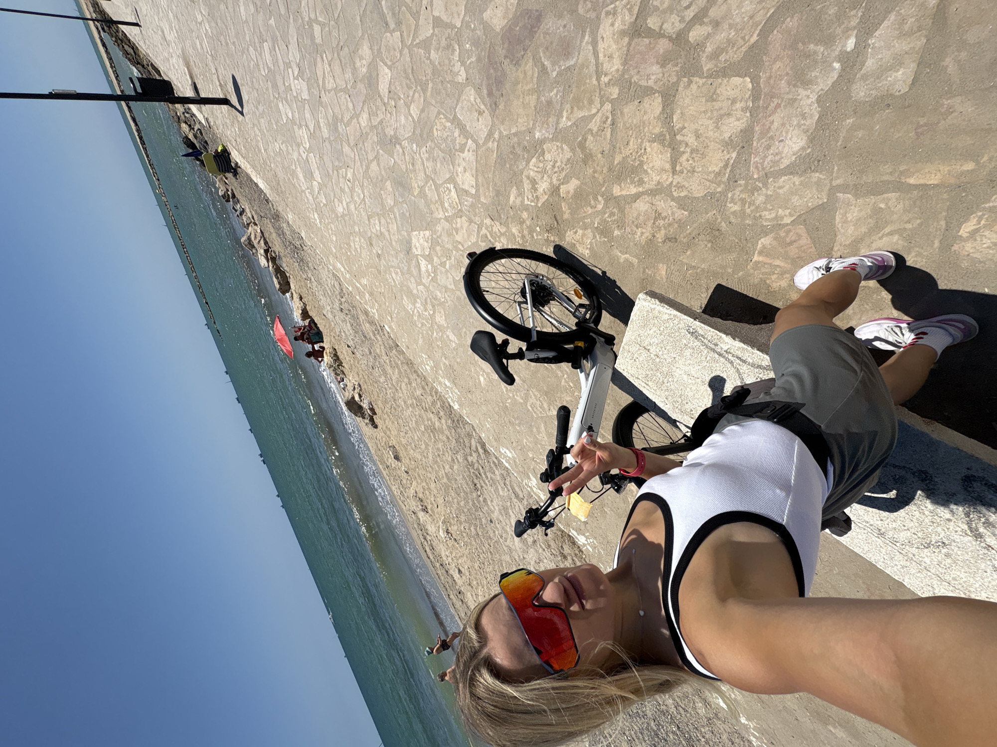 Bikes, scooters, and beach day along Valencia's waterfront path