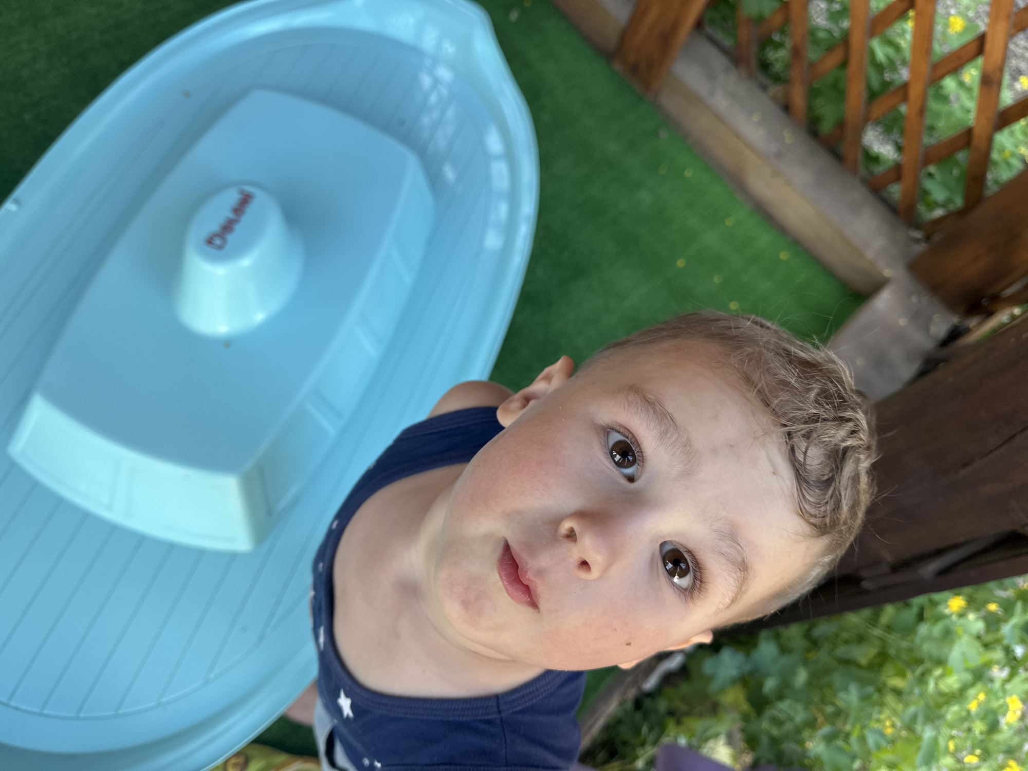 Child plays in backyard garden in Nizhny Novgorod