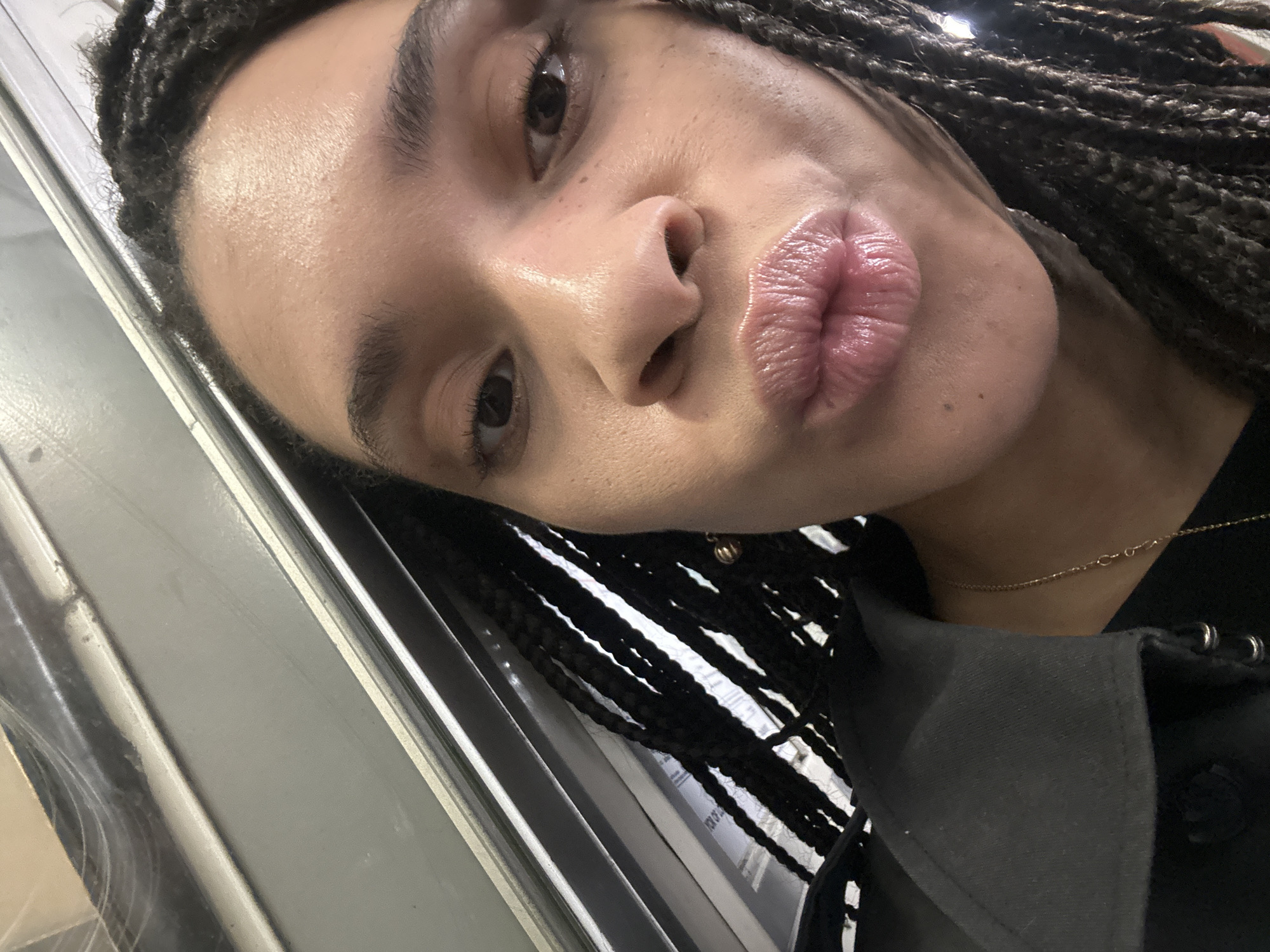 Morning commuter takes playful selfie on London Underground platform